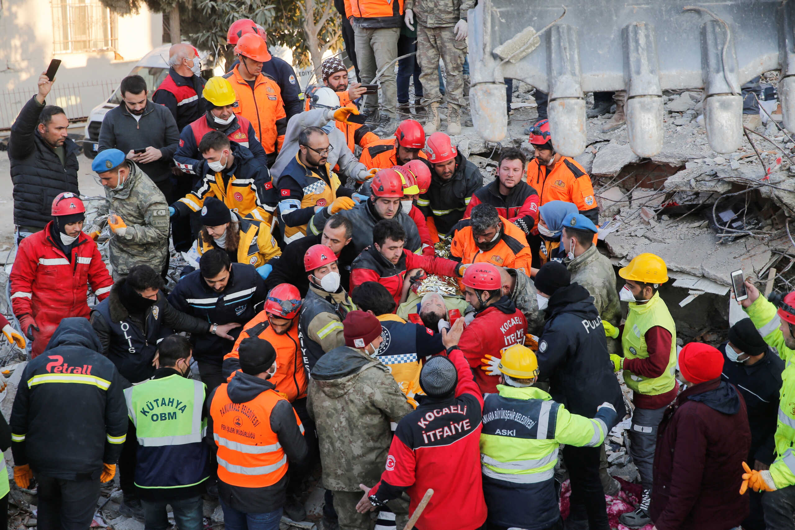 Rescuer workers carry Kaan, a-13-year old Turkish teenager, to an ambulance after being rescued from the rubble after 182 hours, in the aftermath of a deadly earthquake in Hatay, Turkey February 13, 2023. REUTERS