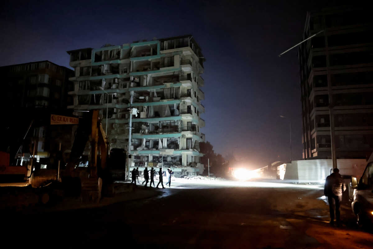 People walk outside after an earthquake in Antakya in Hatay province, Turkey, February 20, 2023.  REUTERS