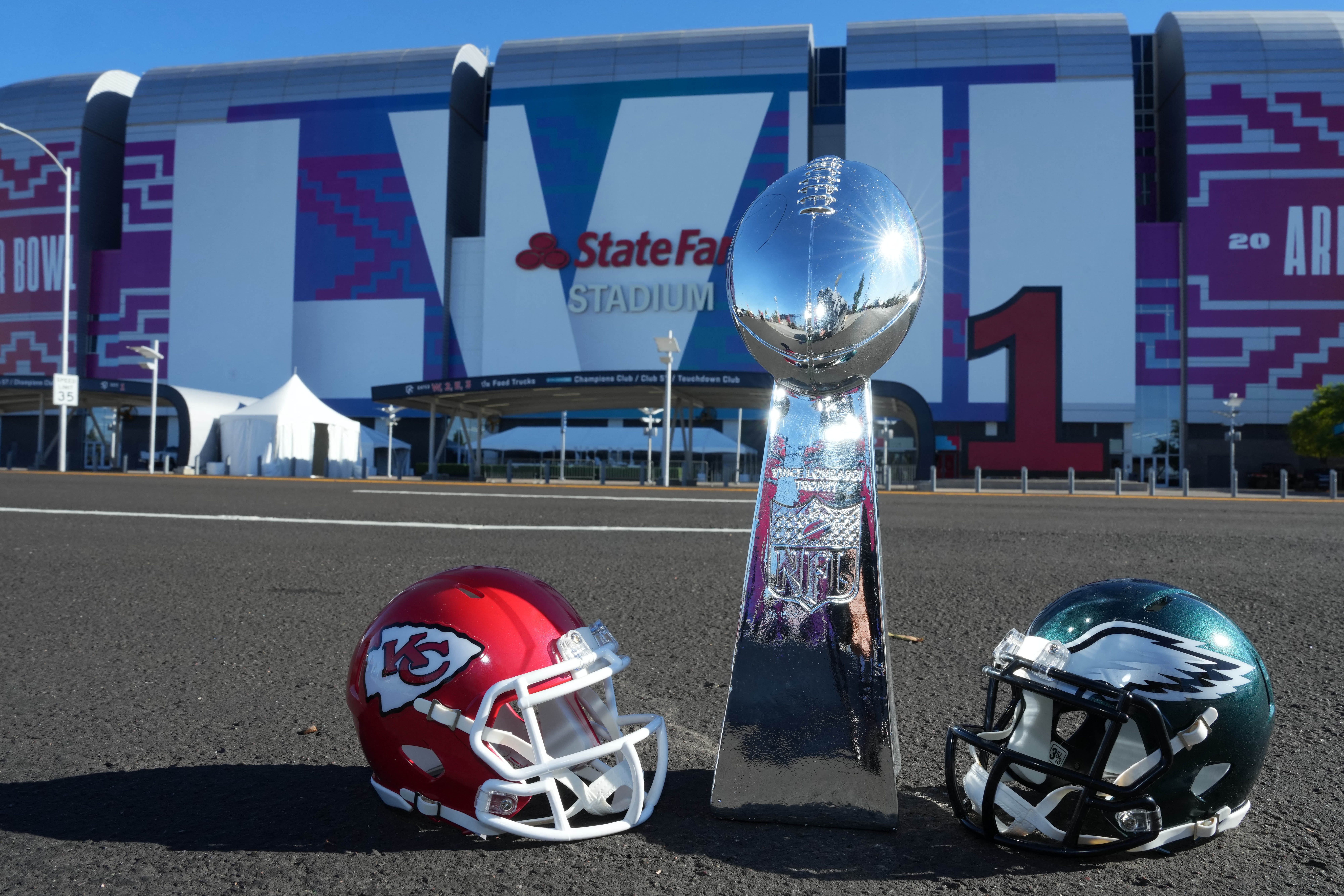 Feb 7, 2023; Phoenix, AZ, USA; The helmets of the Kansas City Chiefs and the Philadelphia Eagles with a Super Bowl Vince Lombardi Trophy at State Farm Stadium. Mandatory Credit: Kirby Lee-USA TODAY Sports