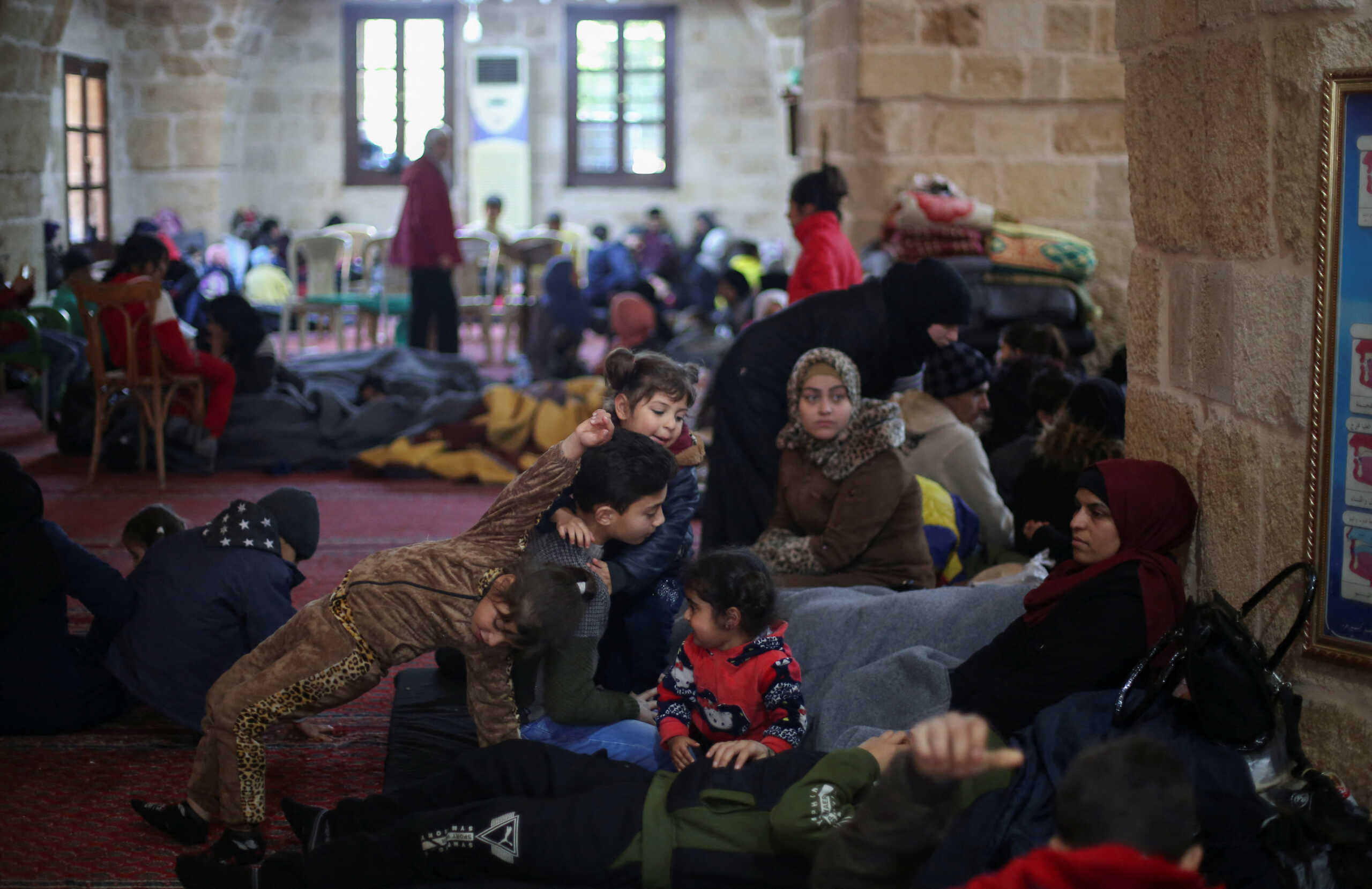 People take shelter inside a mosque, following an earthquake, in Jableh, Syria February 9, 2023. REUTERS
