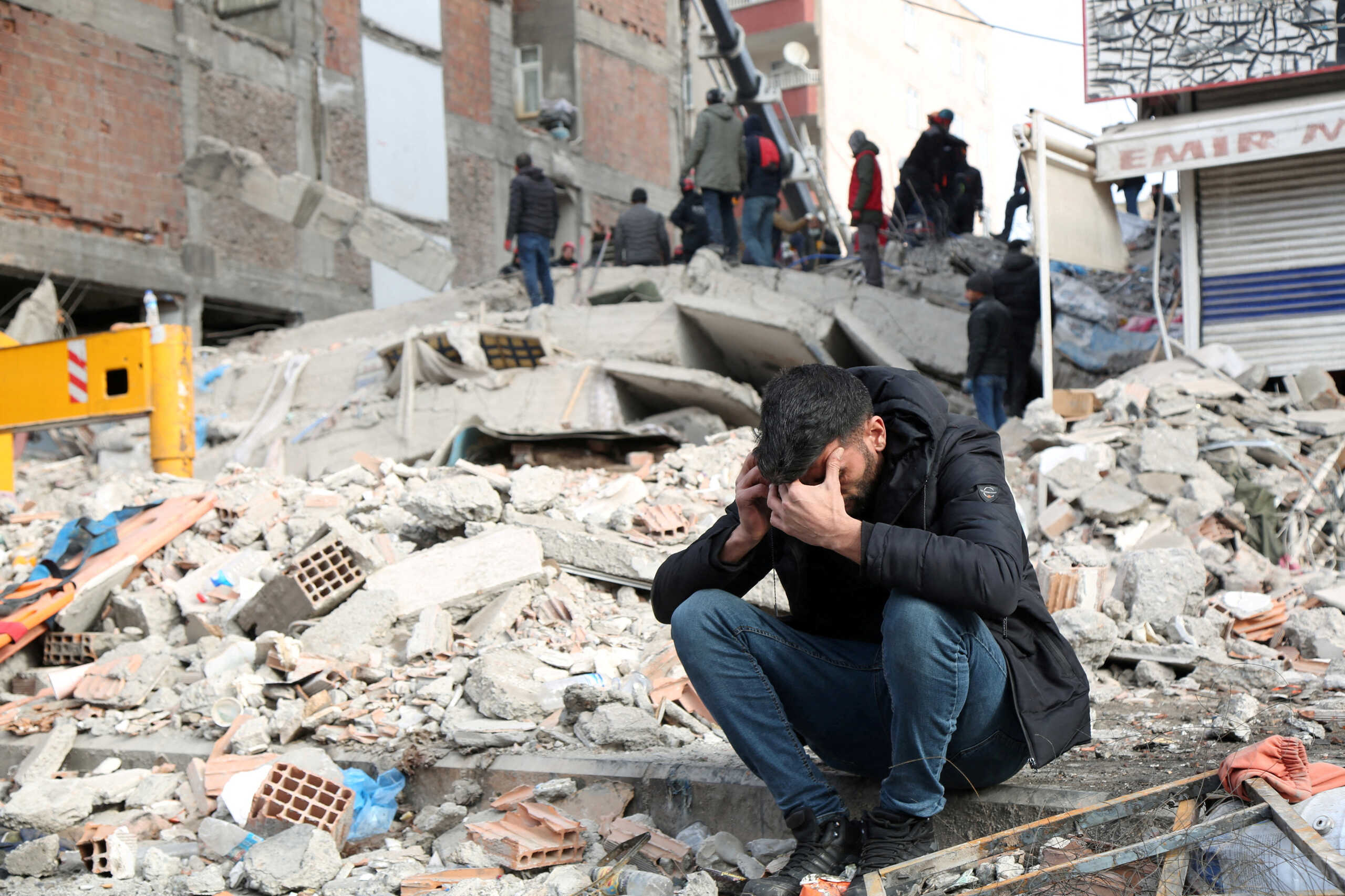 A man reacts at the site of a collapsed building in the aftermath of a deadly earthquake in Diyarbakir, Turkey February 8, 2023. REUTERS