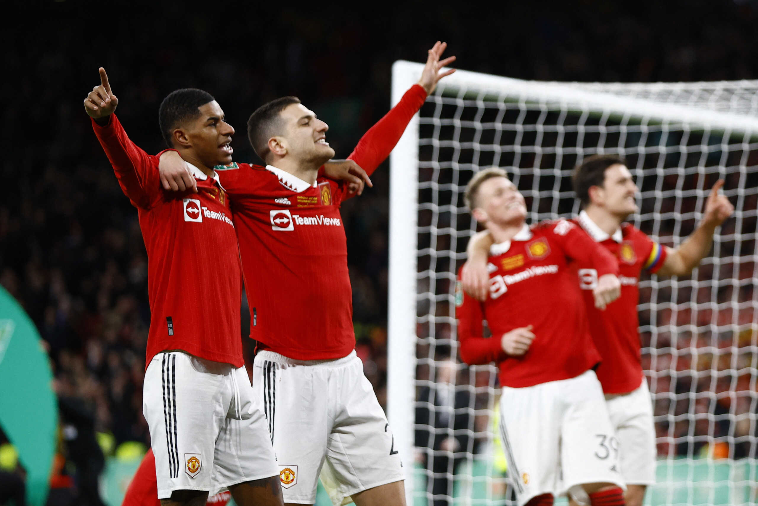 Soccer Football - Carabao Cup - Final - Manchester United v Newcastle United - Wembley Stadium, London, Britain - February 26, 2023  Manchester United's Marcus Rashford and Diogo Dalot celebrate after winning the Carabao Cup final Action Images via Reuters