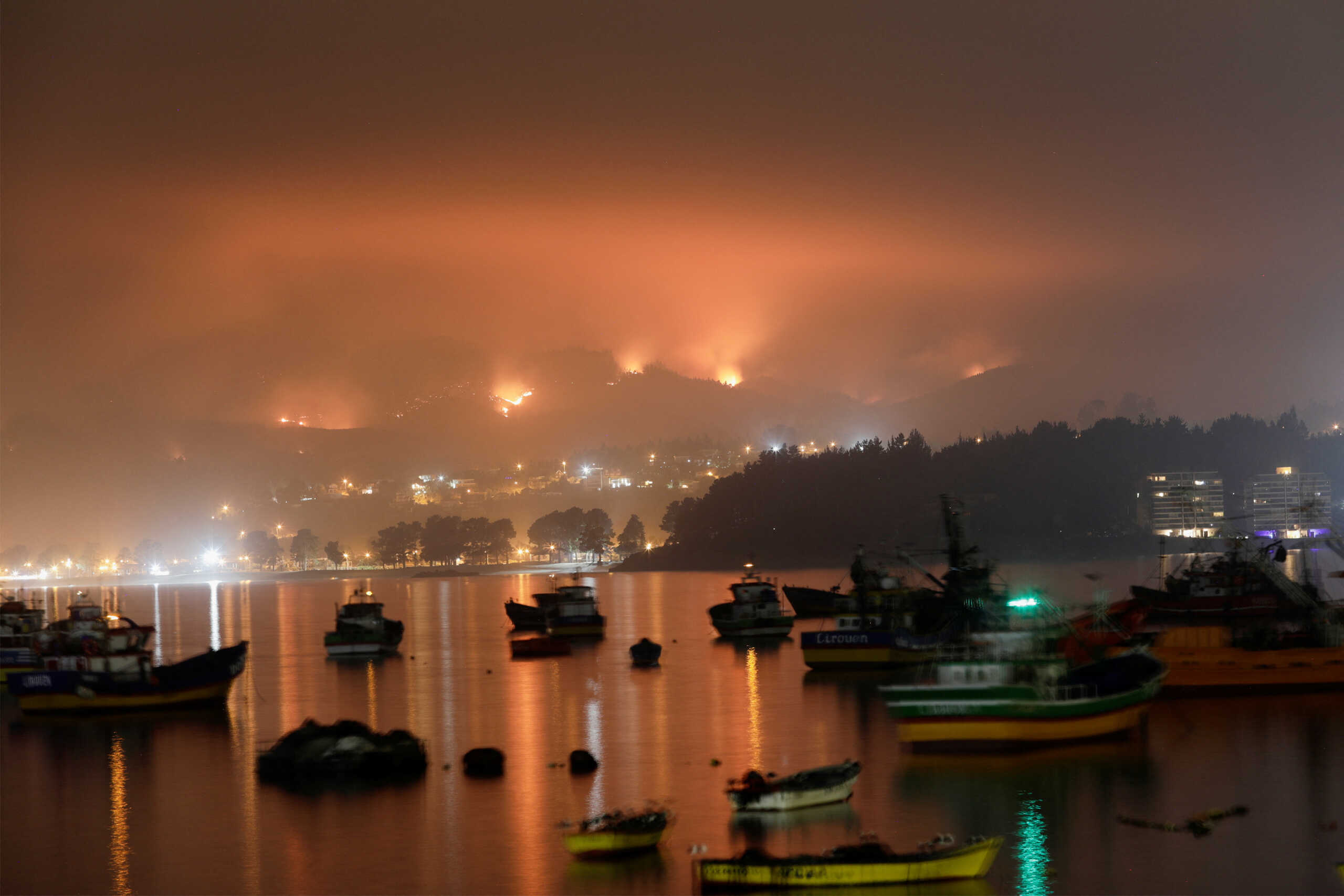 A wildfire burns areas in Dichato, near Concepcion, Chile, February 5, 2023. REUTERS