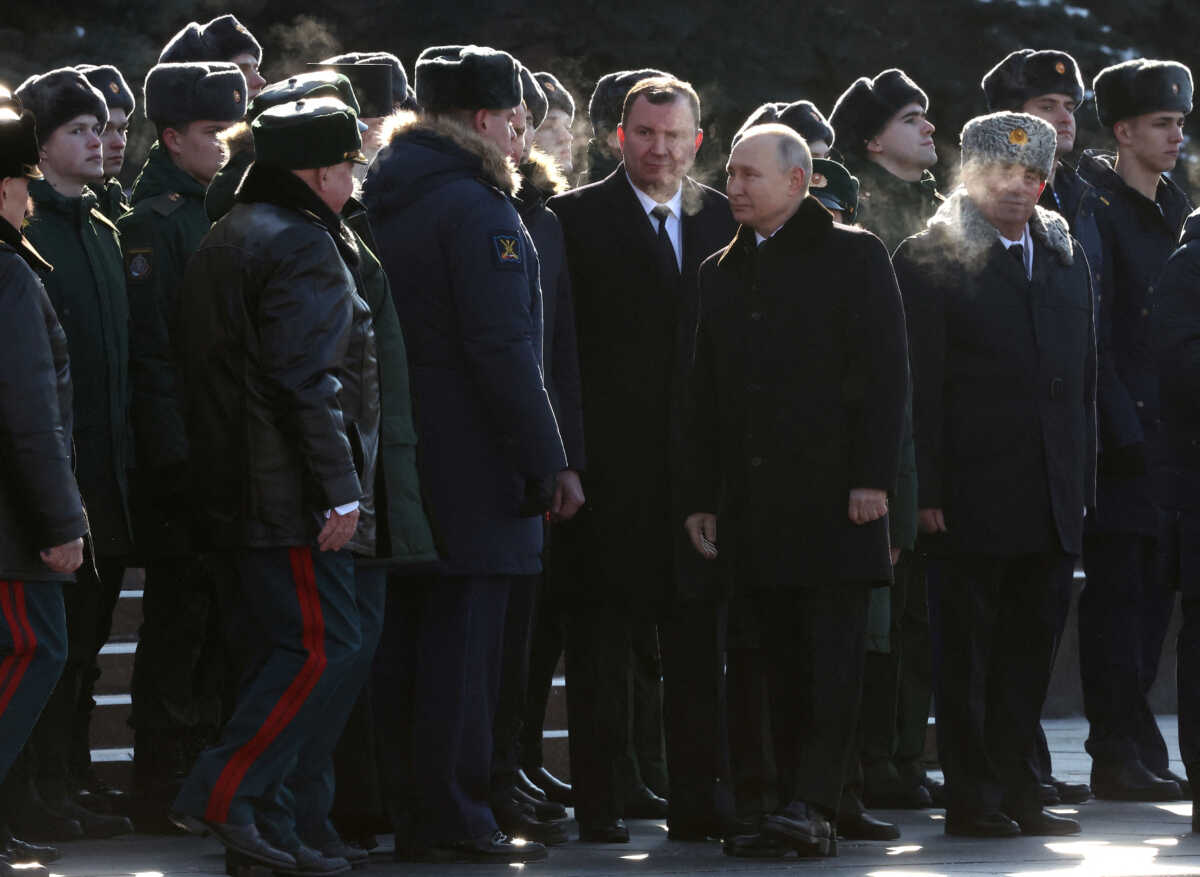 Officials, including Russian President Vladimir Putin, watch honour guards passing by during a ceremony at the Tomb of the Unknown Soldier by the Kremlin Wall on the Defender of the Fatherland Day in Moscow, Russia, February 23, 2023. Sputnik