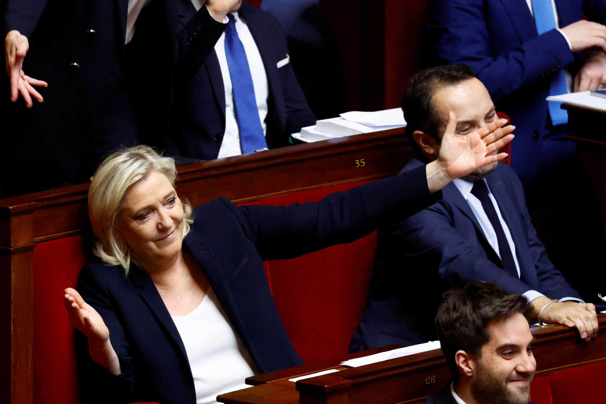 Marine Le Pen, member of parliament and president of the French far-right National Rally (Rassemblement National - RN) party parliamentary group, reacts during debates on two motions of no-confidence against the French government, tabled by centrist group Liot and far-right Rassemblement National party, after the use by French government of the article 49.3, a special clause in the French Constitution, to push the pensions reform bill through the National Assembly without a vote by lawmakers, at the National Assembly in Paris, France, March 20, 2023. REUTERS