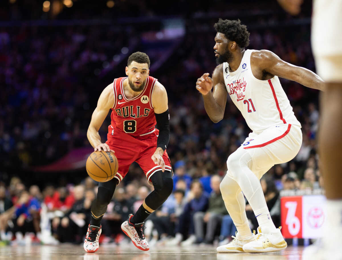 Mar 20, 2023; Philadelphia, Pennsylvania, USA; Chicago Bulls guard Zach LaVine (8) dribbles the ball against Philadelphia 76ers center Joel Embiid (21) during the third quarter at Wells Fargo Center. Mandatory Credit: Bill Streicher-USA TODAY Sports