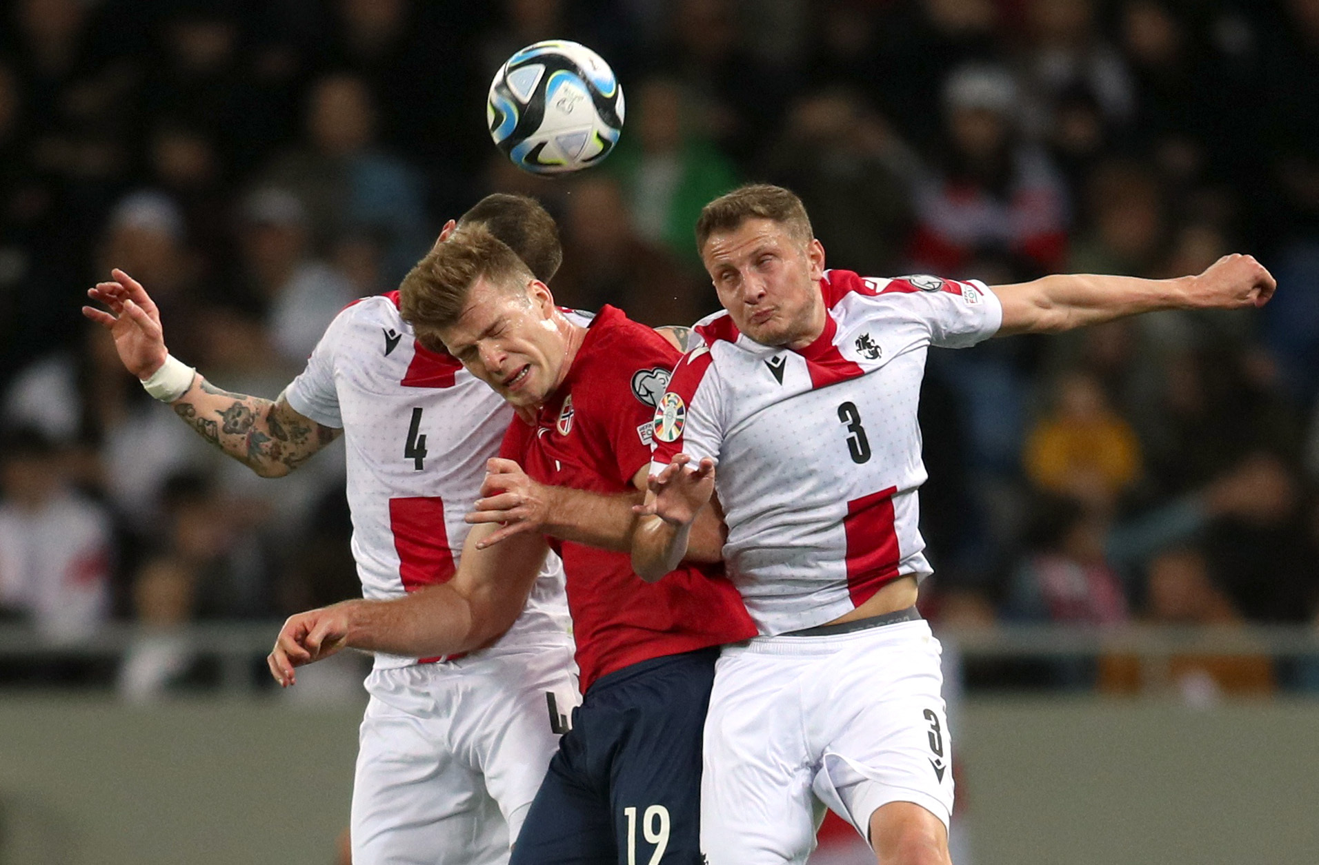 Soccer Football - UEFA Euro 2024 Qualifiers - Group A - Georgia v Norway - Adjarabet Arena, Batumi, Georgia - March 28, 2023 Georgia's Jimmy Tabidze and Guram Kashia in action with Norway's Alexander Sorloth REUTERS