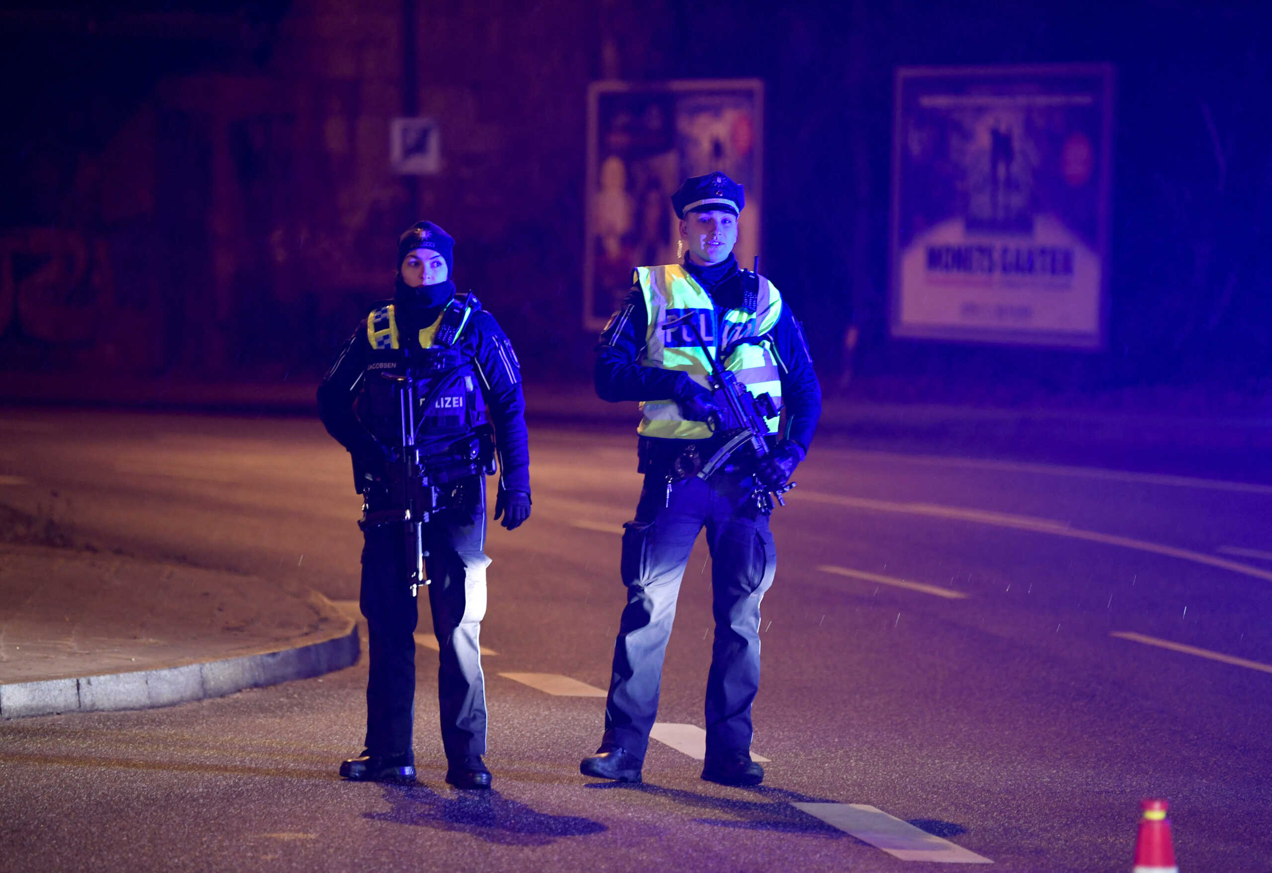 Police secures the area after at least six people are dead and several more injured in a shooting in the northern German city of Hamburg, Germany, March 9, 2023.     REUTERS