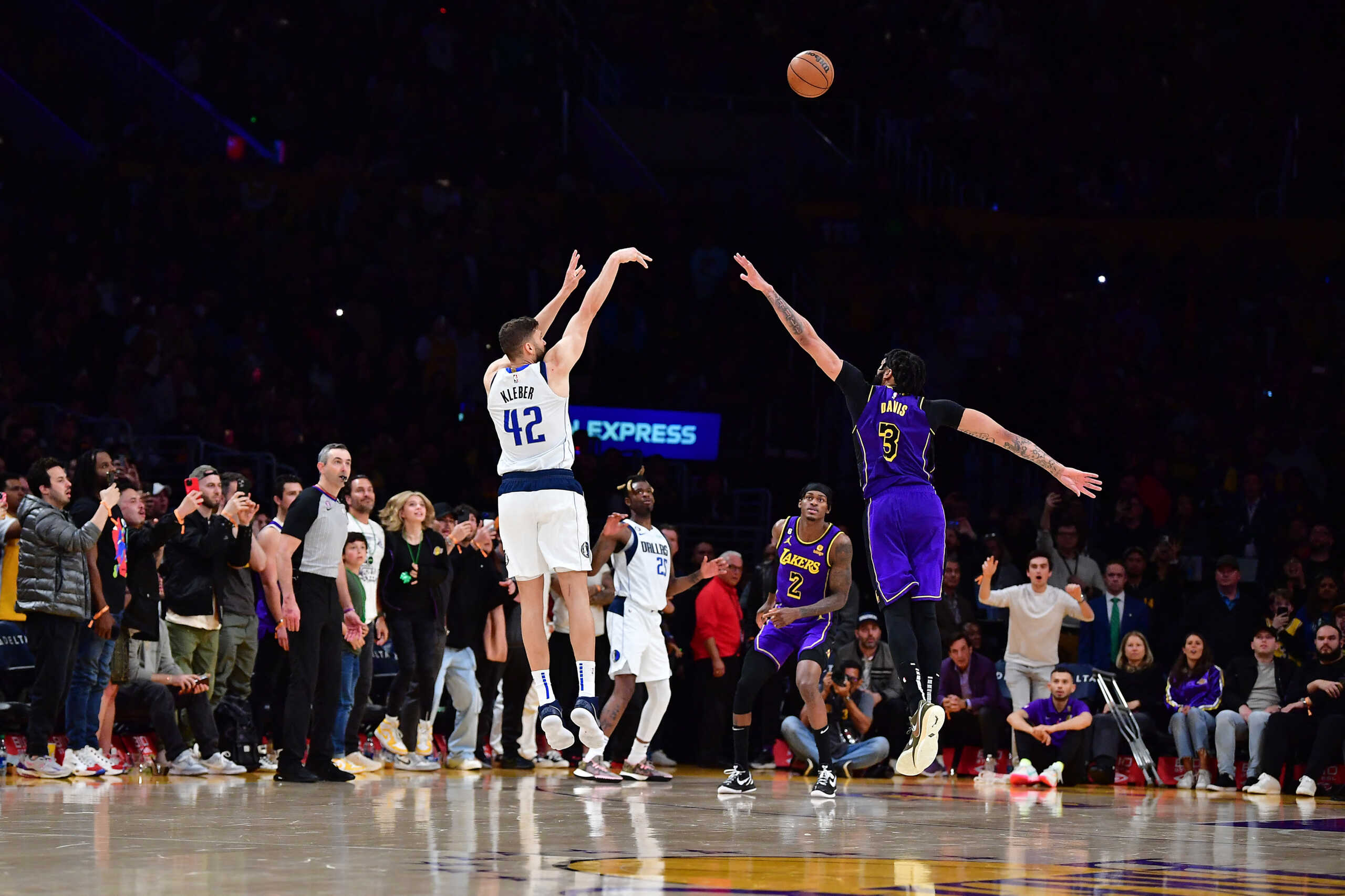 Mar 17, 2023; Los Angeles, California, USA; Dallas Mavericks forward Maxi Kleber (42) scores a three point basket against Los Angeles Lakers forward Anthony Davis (3) for the game victory during the second half at Crypto.com Arena. Mandatory Credit: Gary A. Vasquez-USA TODAY Sports