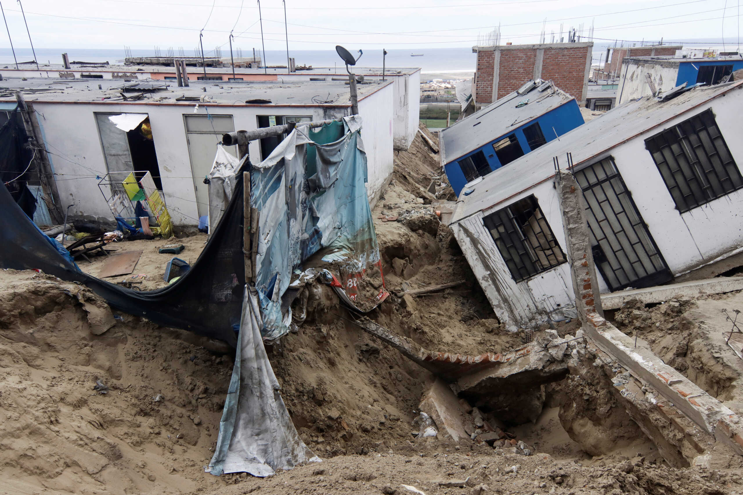 View of damaged houses in the aftermath of the Moche river overflowing due to torrential rains caused by Cyclone Yaku, in Trujillo, Peru, March 13, 2023. REUTERS