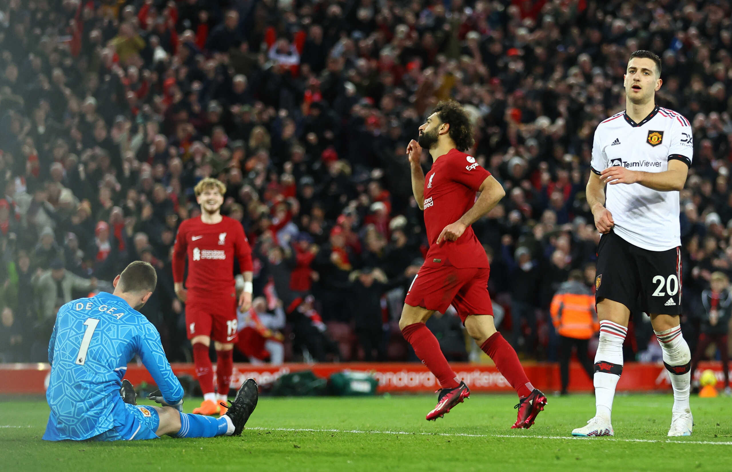 Soccer Football - Premier League - Liverpool v Manchester United - Anfield, Liverpool, Britain - March 5, 2023 Liverpool's Mohamed Salah celebrates scoring their fourth goal as Manchester United's David de Gea looks dejected REUTERS
