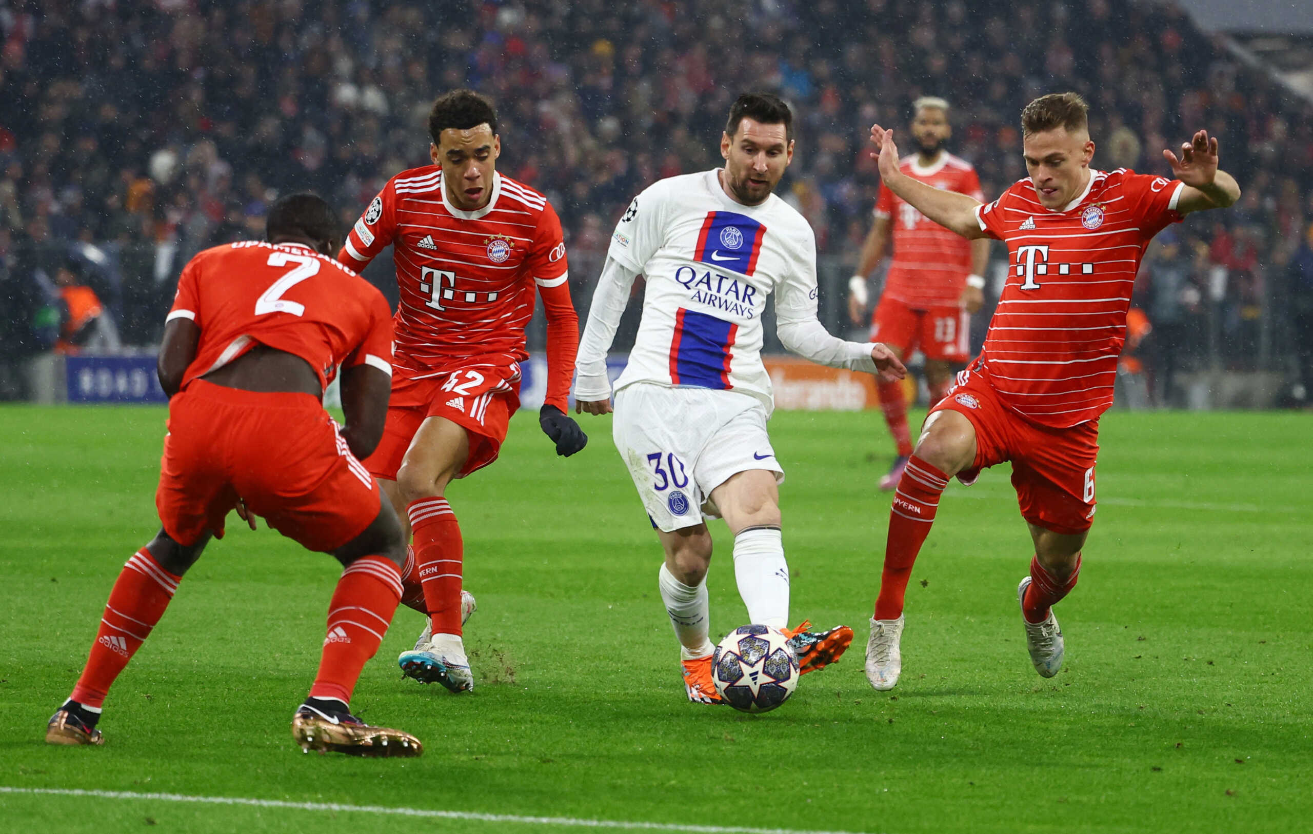 Soccer Football - Champions League - Round of 16 - Second Leg - Bayern Munich v Paris St Germain - Allianz Arena, Munich, Germany - March 8, 2023  Paris St Germain's Lionel Messi in action with Bayern Munich's Jamal Musiala, Joshua Kimmich and Dayot Upamecano REUTERS