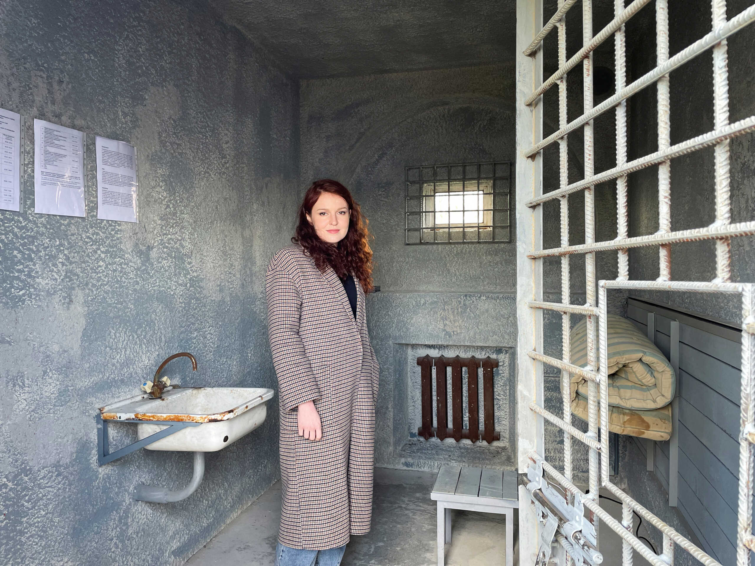 Alexei Navalny's spokeswoman Kira Yarmysh is seen in a replica of the prison cell where the jailed Russian opposition leader is being held, on display as part of the exhibit "Silenced" at Loevestein Castle, the Netherlands, March 30, 2023.   REUTERS