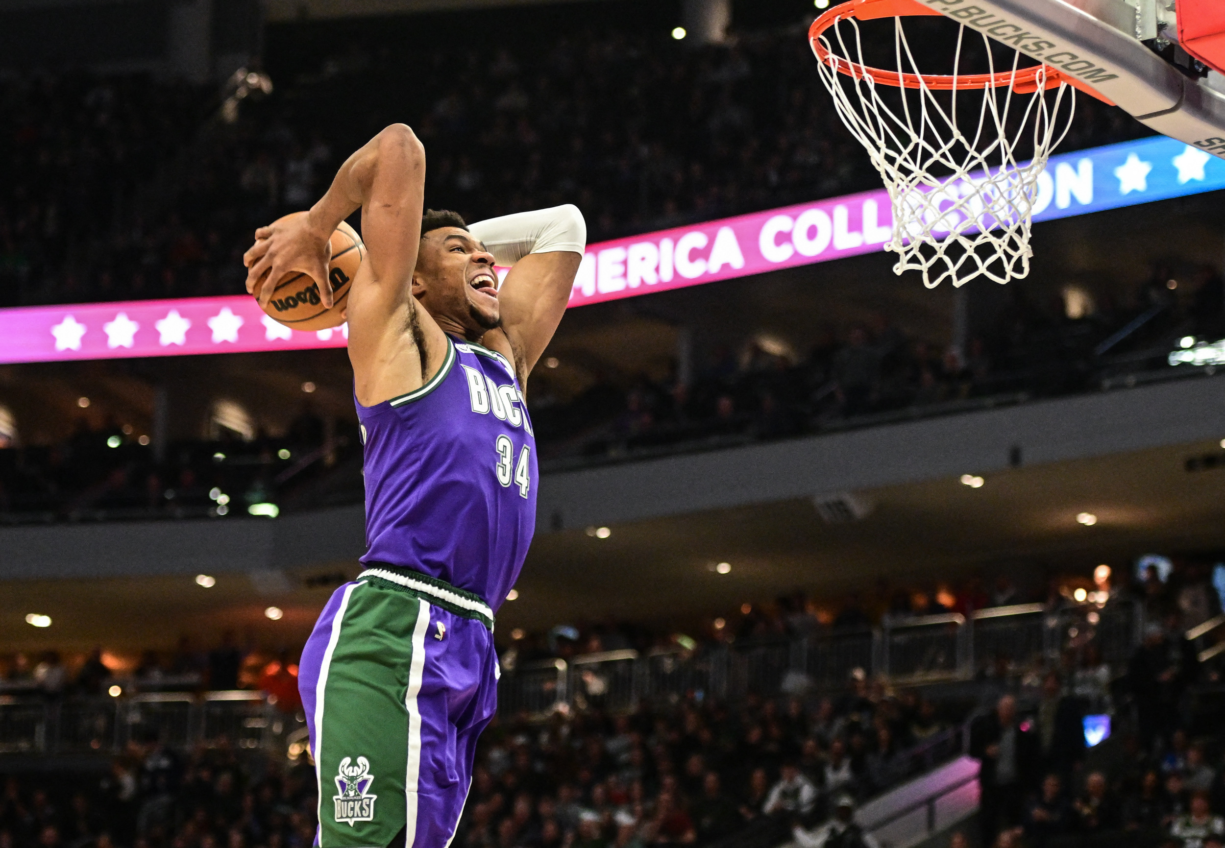 Mar 16, 2023; Milwaukee, Wisconsin, USA; Milwaukee Bucks forward Giannis Antetokounmpo (34) dunks a basket in the first quarter during game against the Indiana Pacers at Fiserv Forum. Mandatory Credit: Benny Sieu-USA TODAY Sports