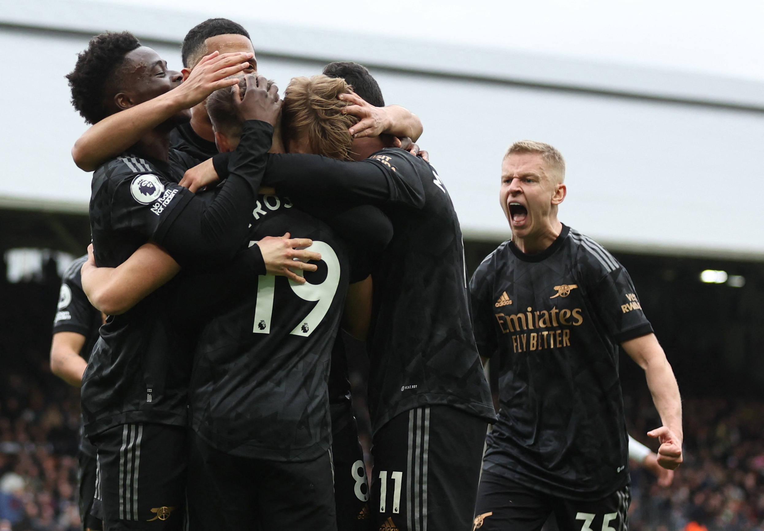 Soccer Football - Premier League - Fulham v Arsenal - Craven Cottage, London, Britain - March 12, 2023 Arsenal's Martin Odegaard celebrates scoring their third goal with teammates REUTERS