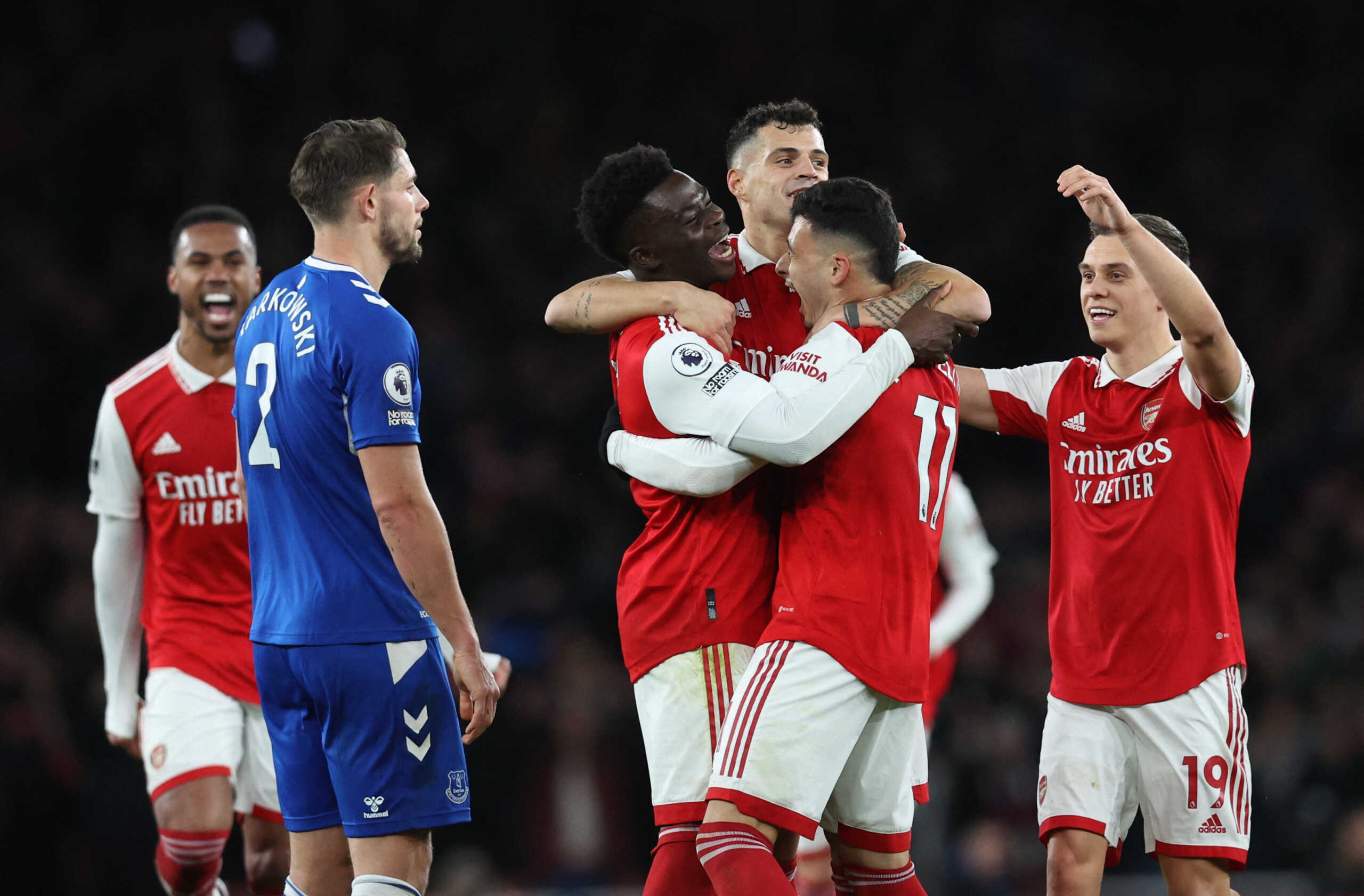Soccer Football - Premier League - Arsenal v Everton - Emirates Stadium, London, Britain - March 1, 2023 Arsenal's Gabriel Martinelli celebrates scoring their second goal with Bukayo Saka, Granit Xhaka and Leandro Trossard as Everton's James Tarkowski looks dejected REUTERS