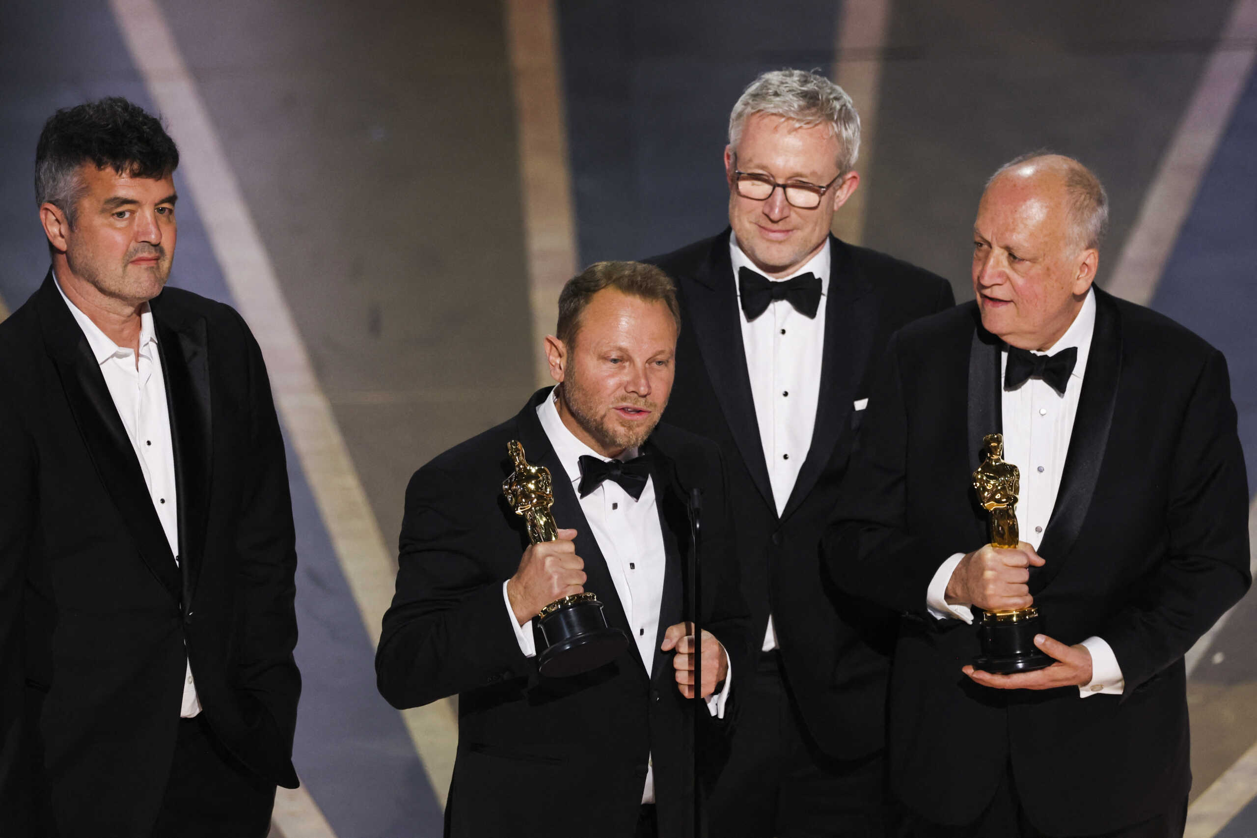 Joe Letteri, Richard Baneham, Eric Saindon and Daniel Barrett win the Oscar for Best Visual Effects for "Avatar: The Way Of Water" during the Oscars show at the 95th Academy Awards in Hollywood, Los Angeles, California, U.S., March 12, 2023. REUTERS