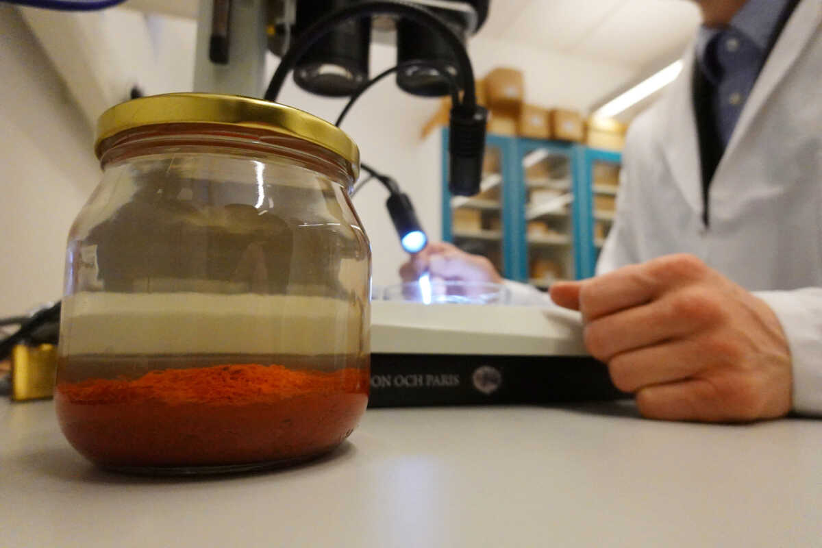 A jar containing saffron preserved in water that was retrieved from the wreck of a 15th century Danish warship, the Gribshunden, after more than 500 years on the seabed, sits in a laboratory in Lund University, Denmark, March 2, 2023. REUTERS