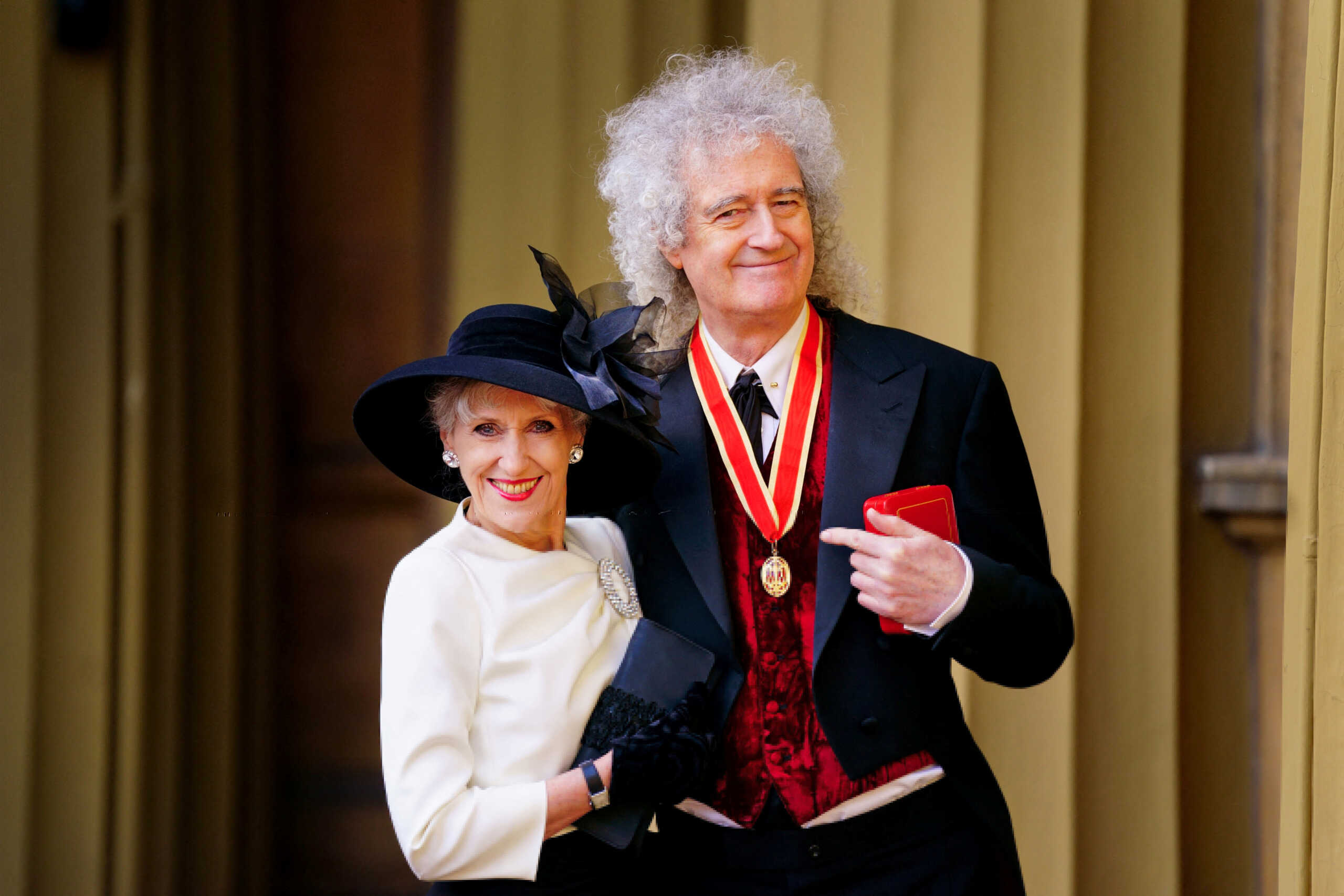 Brian May of the band Queen after being made a Knight Bachelor for services to music and charity by King Charles III, with his wife Anita Dobson, during an investiture ceremony at Buckingham Palace, London, Britain, March 14, 2023. Victoria Jones