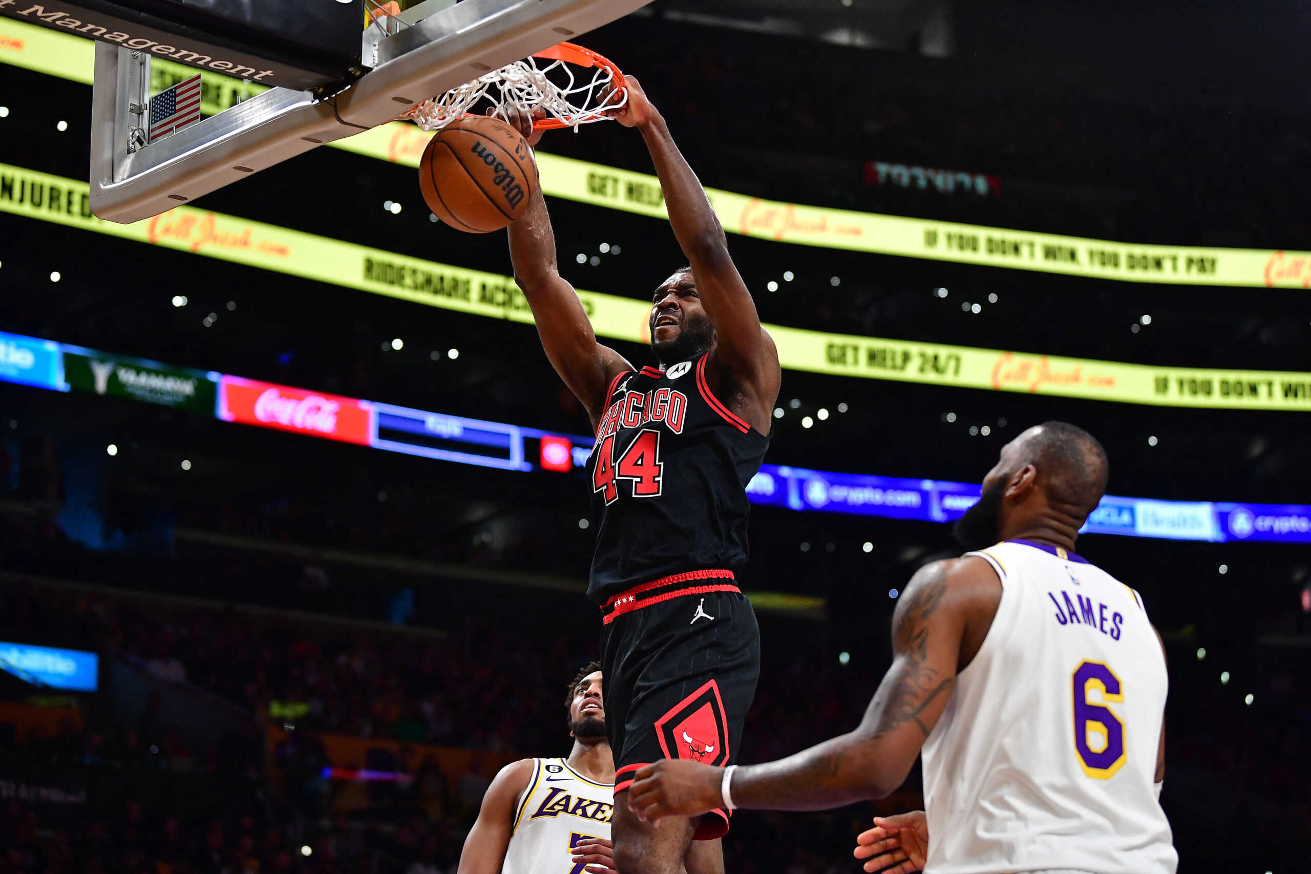Mar 26, 2023; Los Angeles, California, USA; Chicago Bulls forward Patrick Williams (44) dunks for the basket in front of Los Angeles Lakers forward LeBron James (6) during the second half at Crypto.com Arena. Mandatory Credit: Gary A. Vasquez-USA TODAY Sports