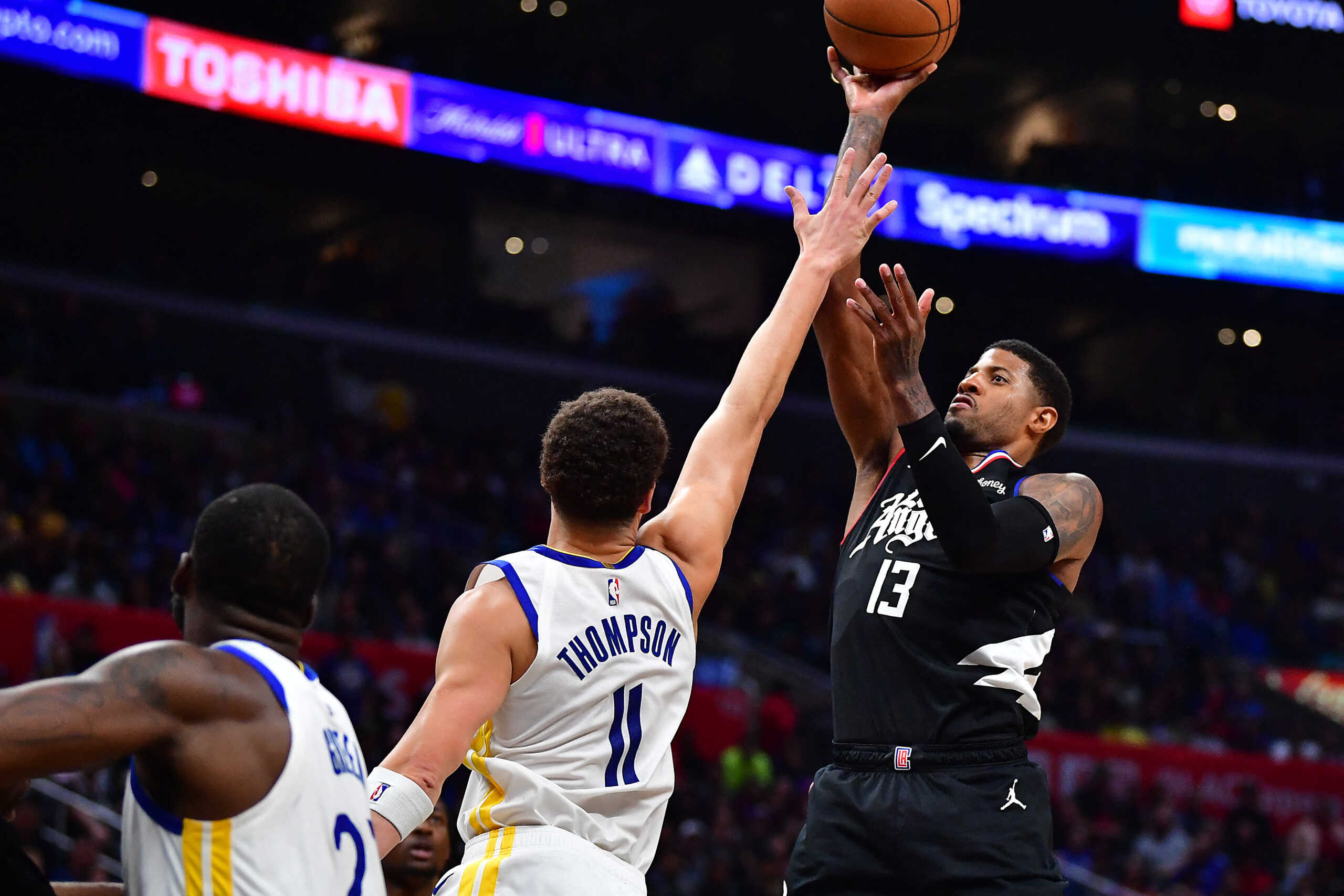 Mar 15, 2023; Los Angeles, California, USA; Los Angeles Clippers forward Paul George (13) shoots against Golden State Warriors guard Klay Thompson (11) during the second half at Crypto.com Arena. Mandatory Credit: Gary A. Vasquez-USA TODAY Sports