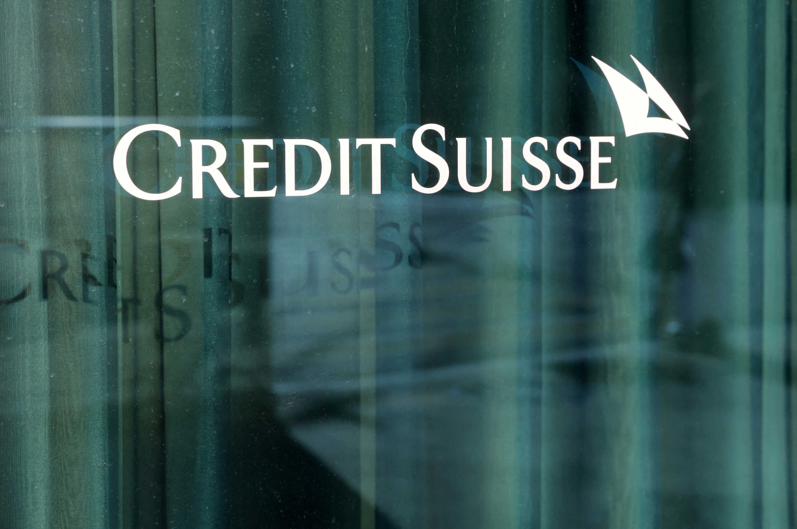 FILE PHOTO: A logo is pictured on the Credit Suisse bank in Geneva, Switzerland, March 15, 2023. REUTERS