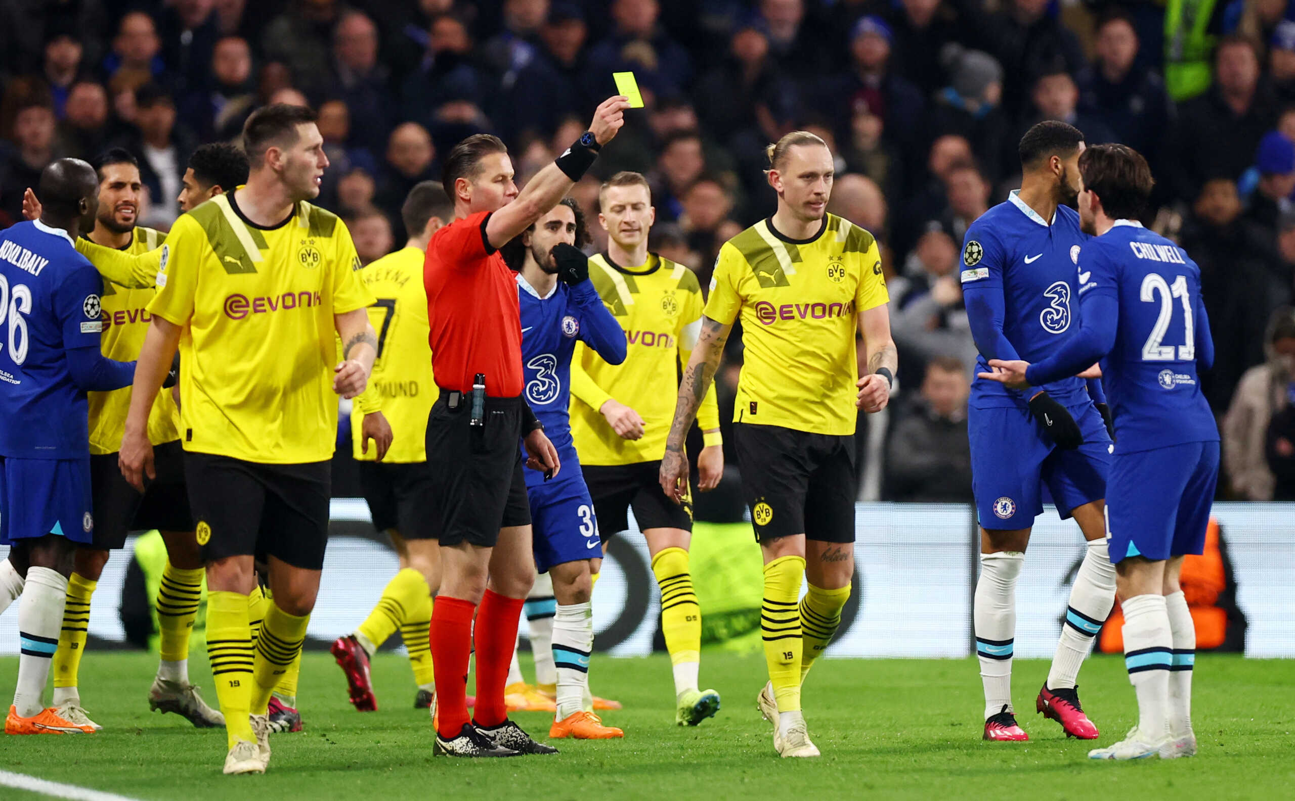 Soccer Football - Champions League - Round of 16 - Second Leg - Chelsea v Borussia Dortmund - Stamford Bridge, London, Britain - March 7, 2023 Chelsea's Ben Chilwell and Borussia Dortmund's Marius Wolf are shown yellow cards by referee Danny Makkelie REUTERS