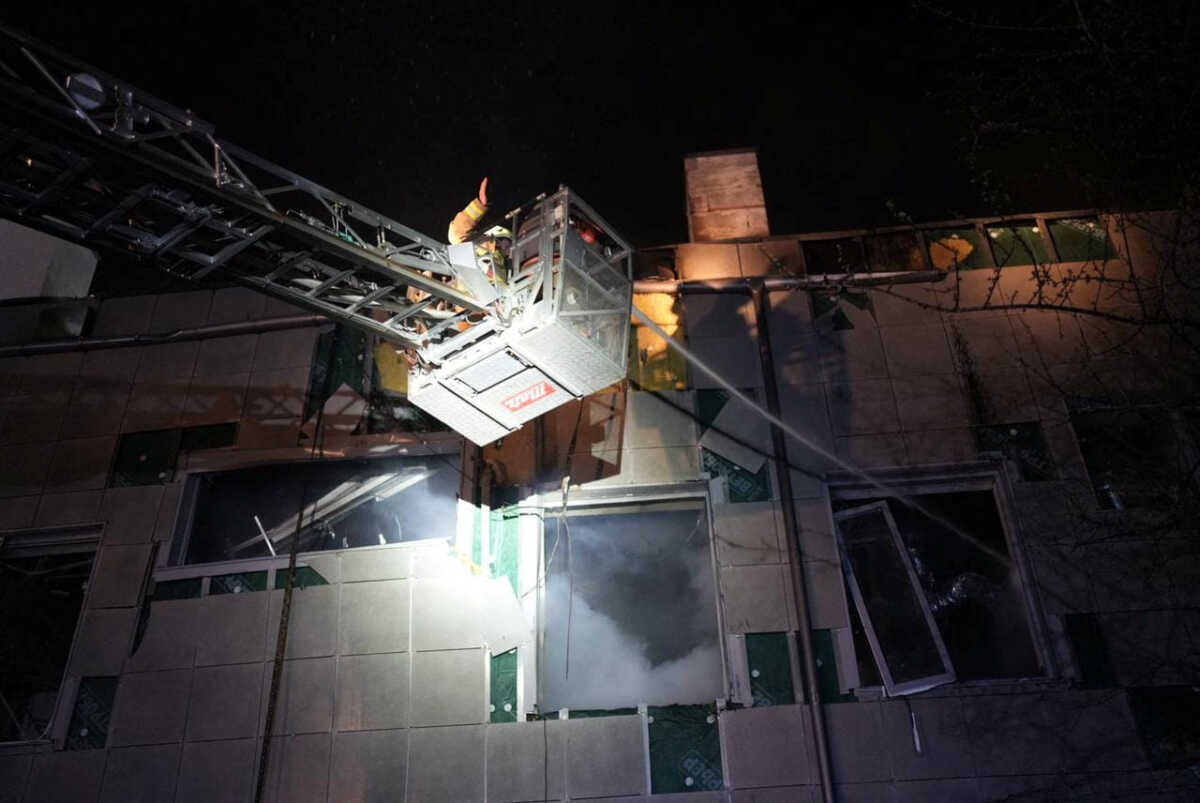 Rescuers work at the site where a building was damaged in the night by Russian drone strikes, amid Russia's attack on Ukraine, in Kyiv, Ukraine March 28, 2023. Press service of the State Emergency Service of Ukraine