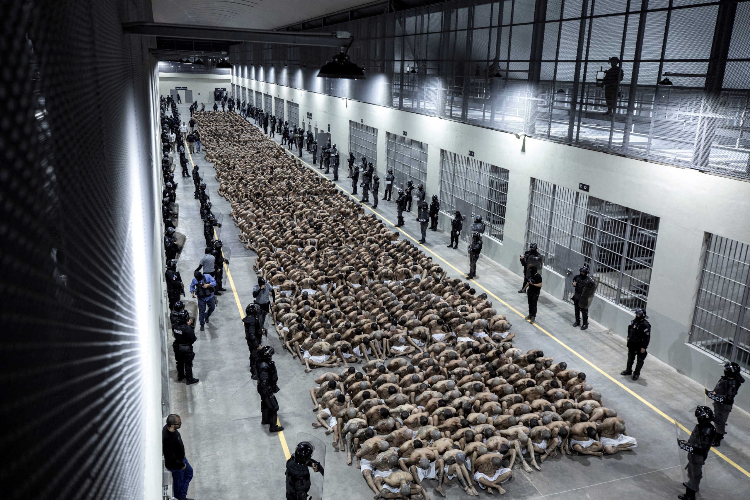 Gang members wait to be taken to their cell after 2000 gang members were transferred to the Terrorism Confinement Center, according to El Salvador's President Nayib Bukele, in Tecoluca, El Salvador, in this handout distributed to Reuters on March 15, 2023. Secretaria de Prensa de la Presidencia