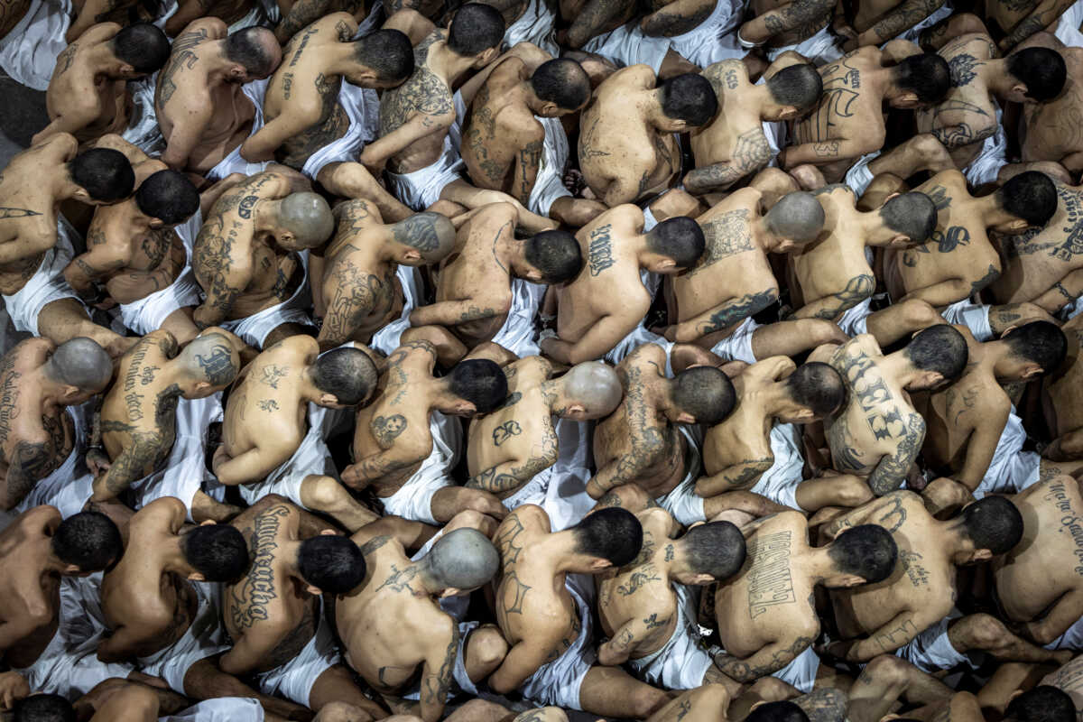 Gang members wait to be taken to their cell after 2000 gang members were transferred to the Terrorism Confinement Center, according to El Salvador's President Nayib Bukele, in Tecoluca, El Salvador, in this handout distributed to Reuters on March 15, 2023. Secretaria de Prensa de la Presidencia