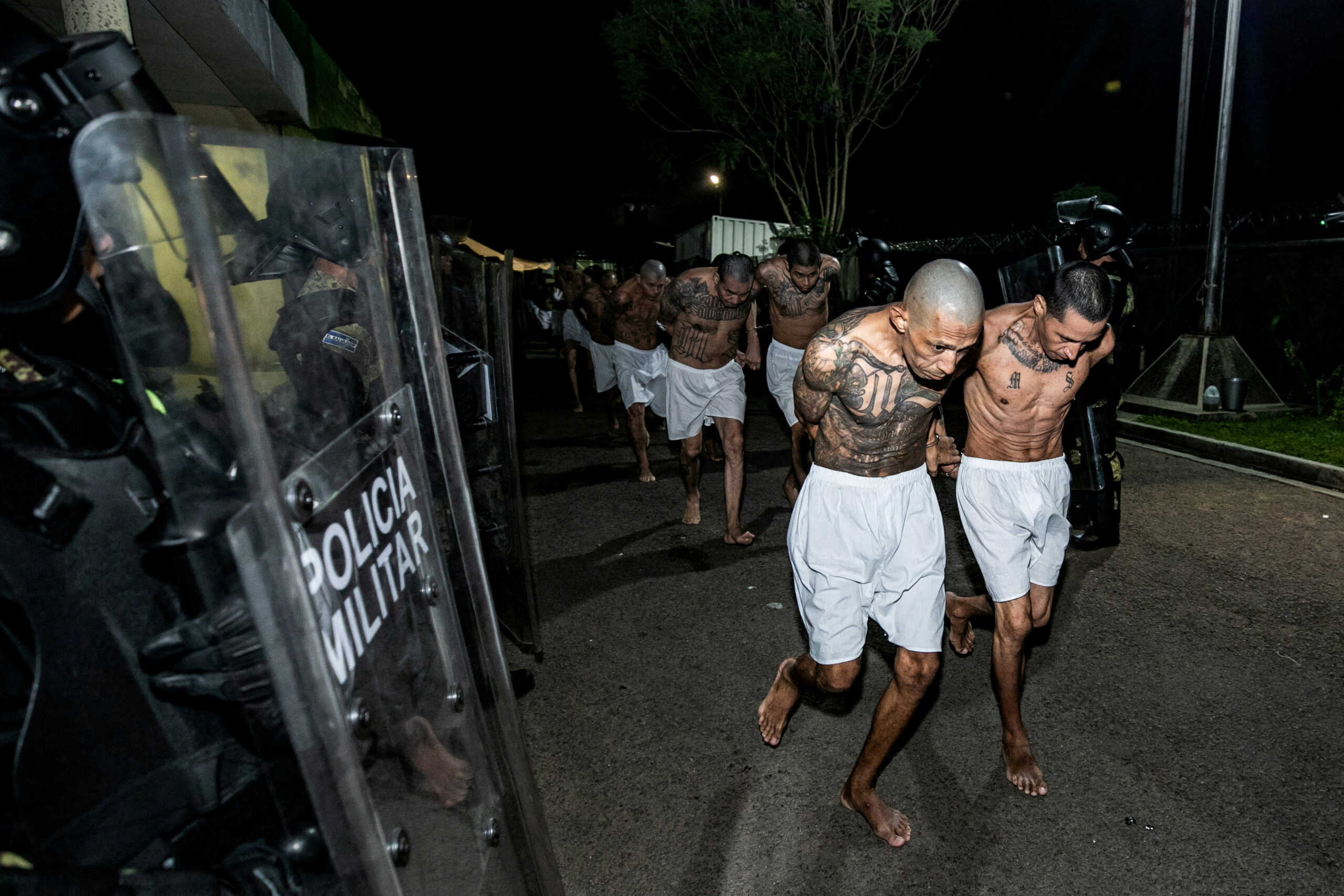 Gang members wait to be taken to their cell after 2000 gang members were transferred to the Terrorism Confinement Center, according to El Salvador's President Nayib Bukele, in Tecoluca, El Salvador, in this handout distributed to Reuters on March 15, 2023. Secretaria de Prensa de la Presidencia