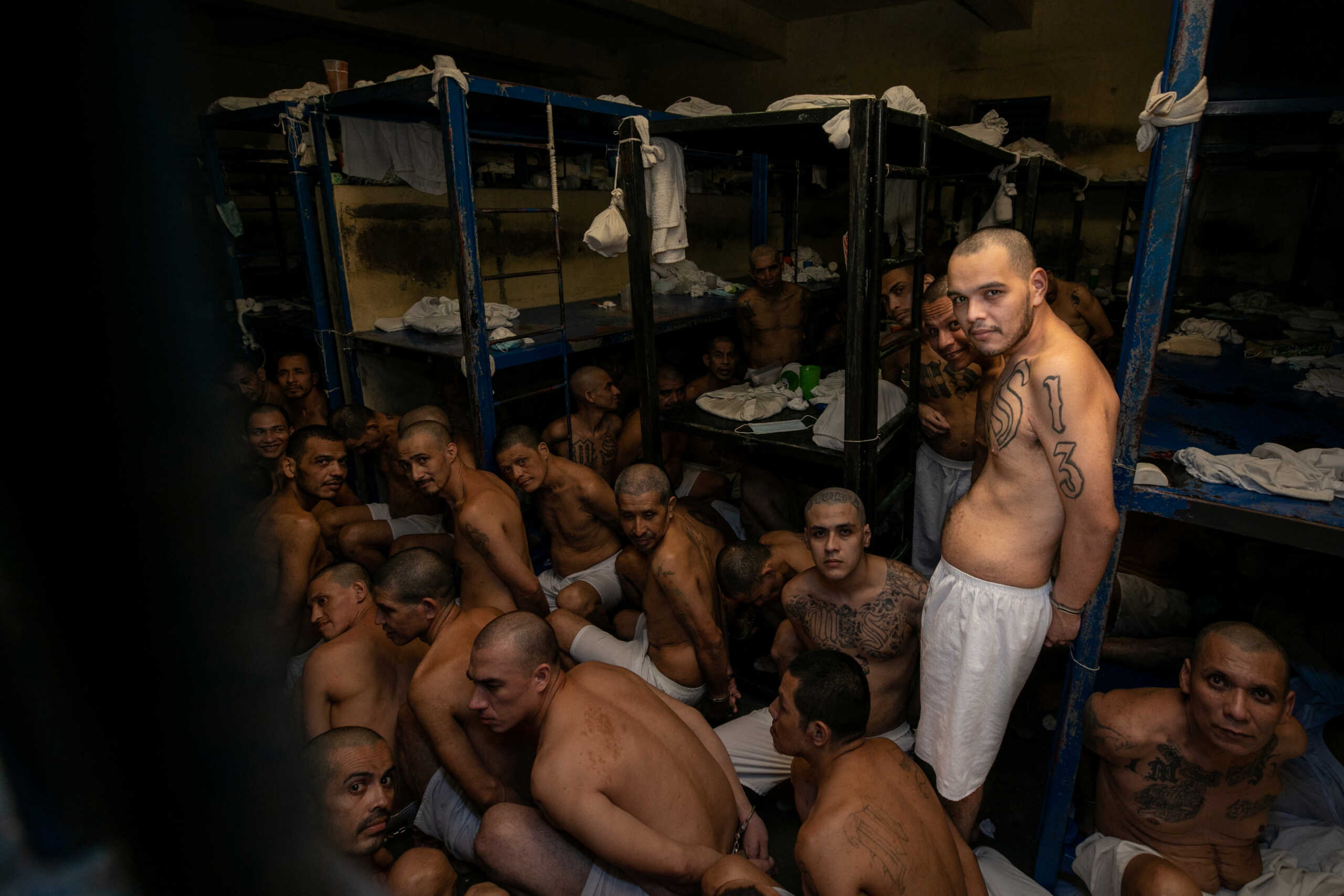 Gang members remain in their cell after 2000 gang members were transferred to the Terrorism Confinement Center, according to El Salvador's President Nayib Bukele, in Tecoluca, El Salvador, in this handout distributed to Reuters on March 15, 2023. Secretaria de Prensa de la Presidencia