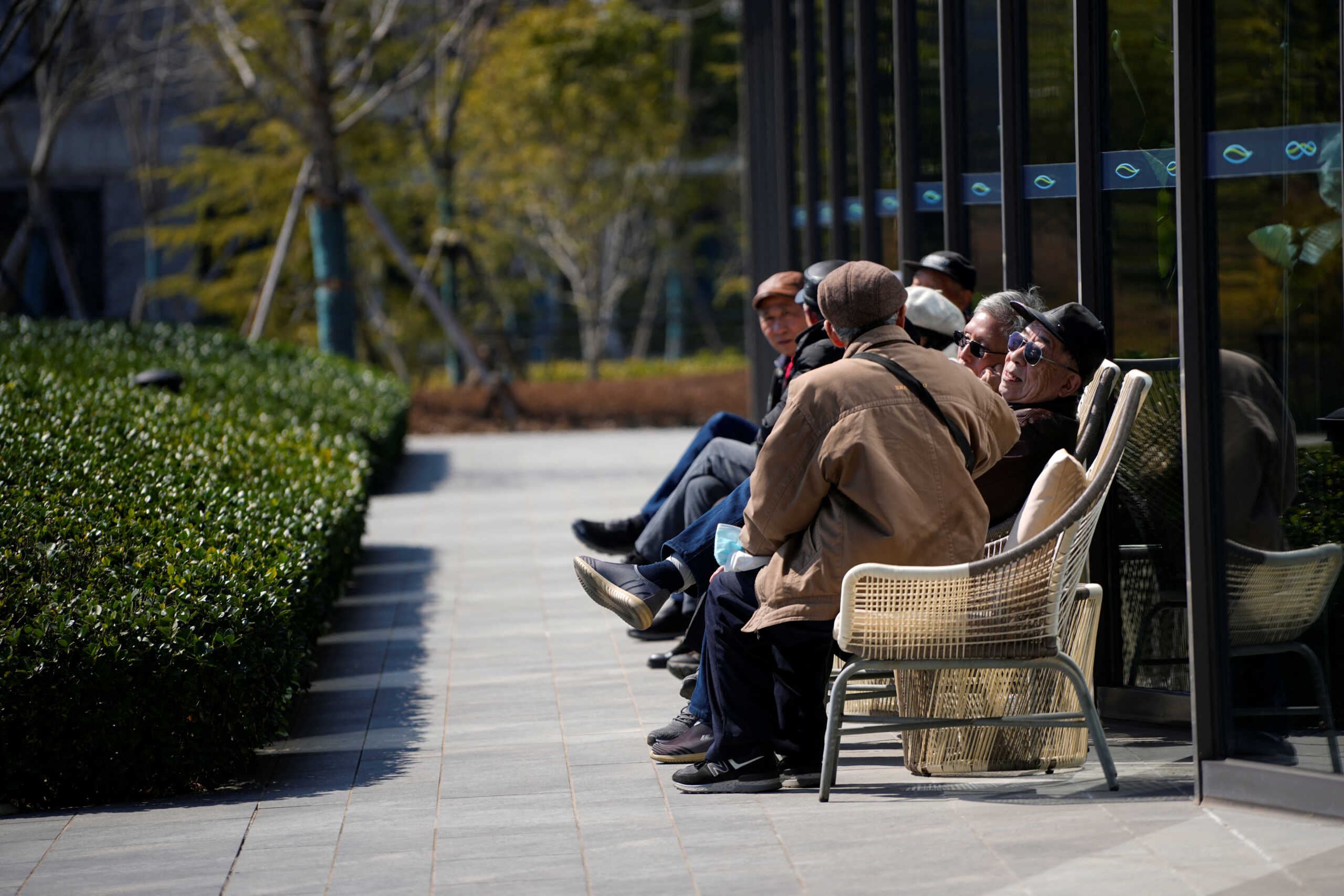 Elderly visitors enjoy the sunshine, at a nursing home of Lendlease's Ardor Gardens in Shanghai, China February 27, 2023. REUTERS