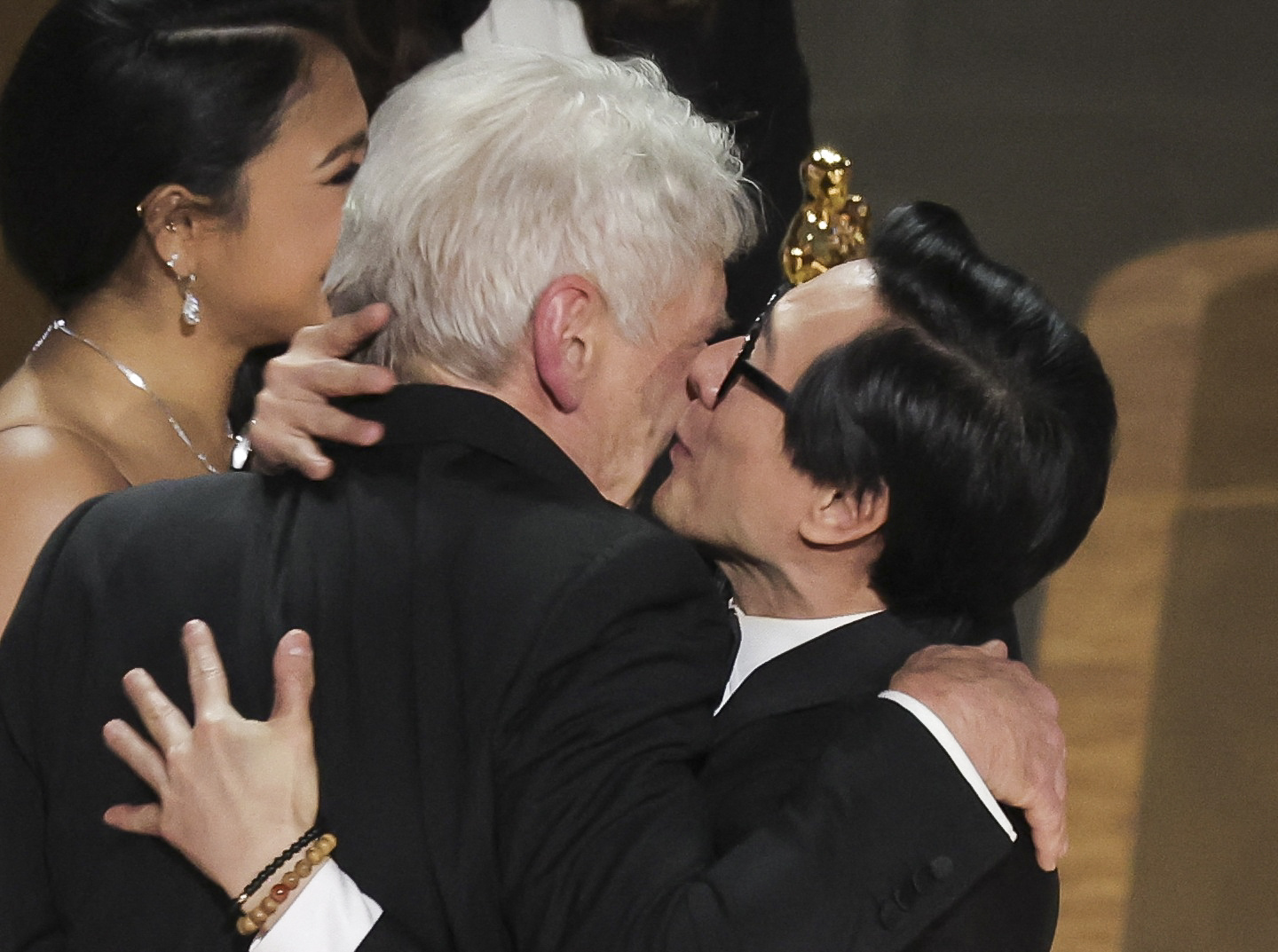 Ke Huy Quan kisses Harrison Ford as he receives the Oscar for Best Picture from him after "Everything Everywhere All at Once" won during the Oscars show at the 95th Academy Awards in Hollywood, Los Angeles, California, U.S., March 12, 2023. REUTERS