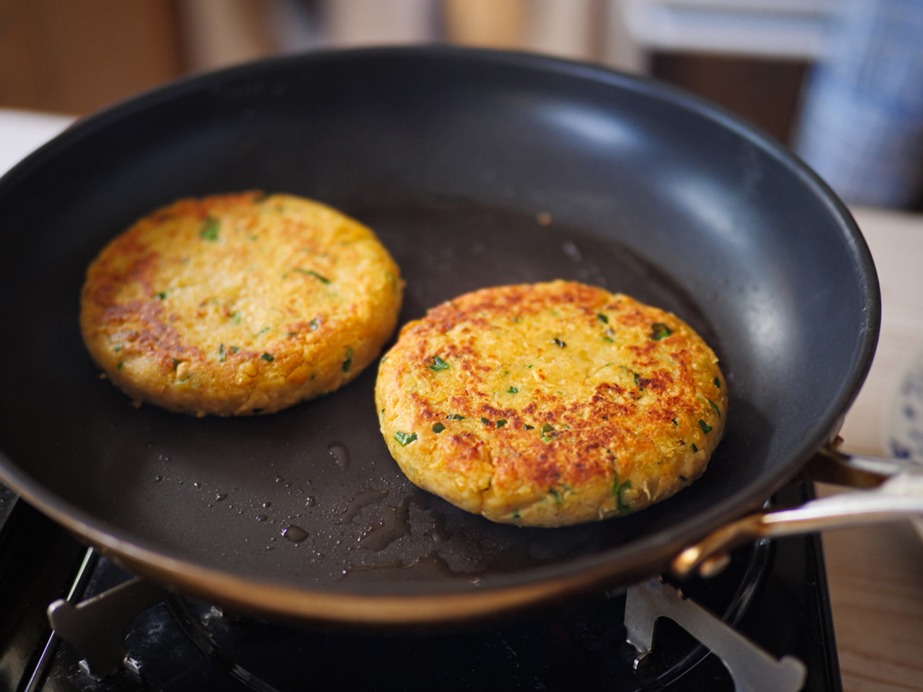 close up view of hand made chickpea,white beans cumin vegan burger at home kitchen