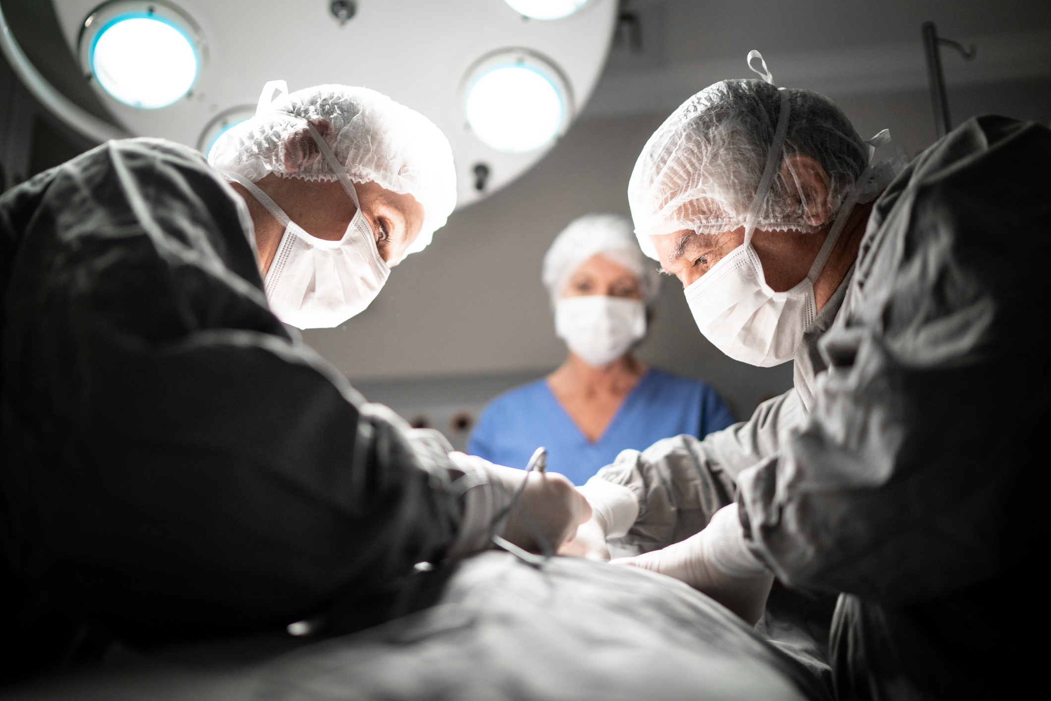 Doctors doing a surgery on operating room in hospital