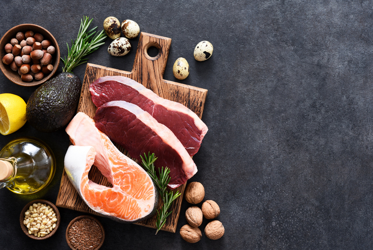 Fish, meat and vegetables on a concrete background. Foods with vitamin b content. Balanced diet. The keto diet.