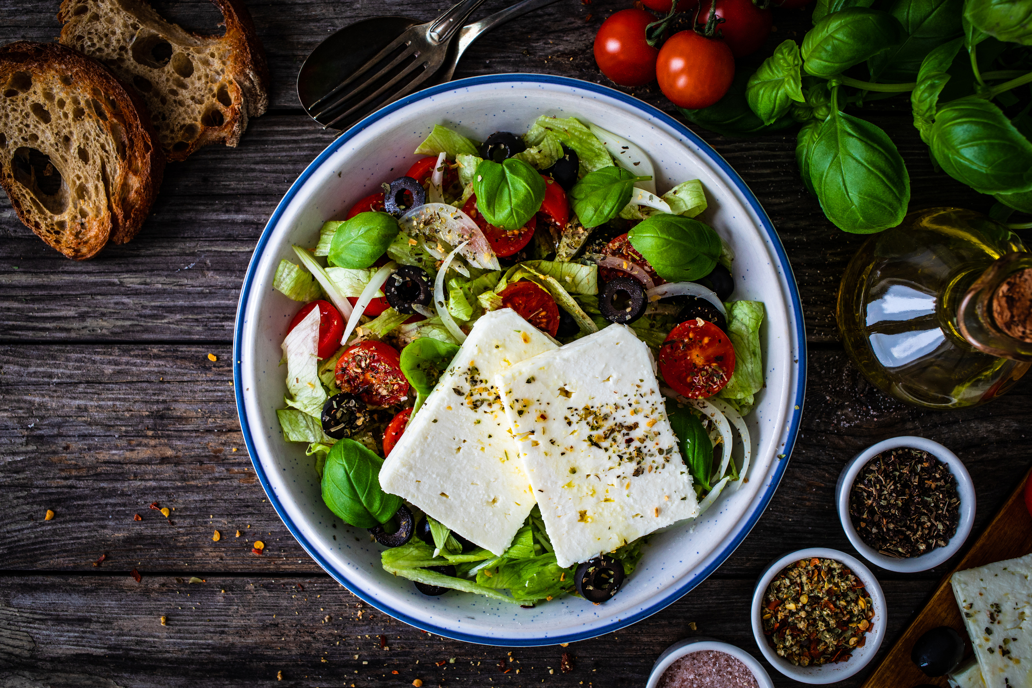 Feta cheese salad on wooden table