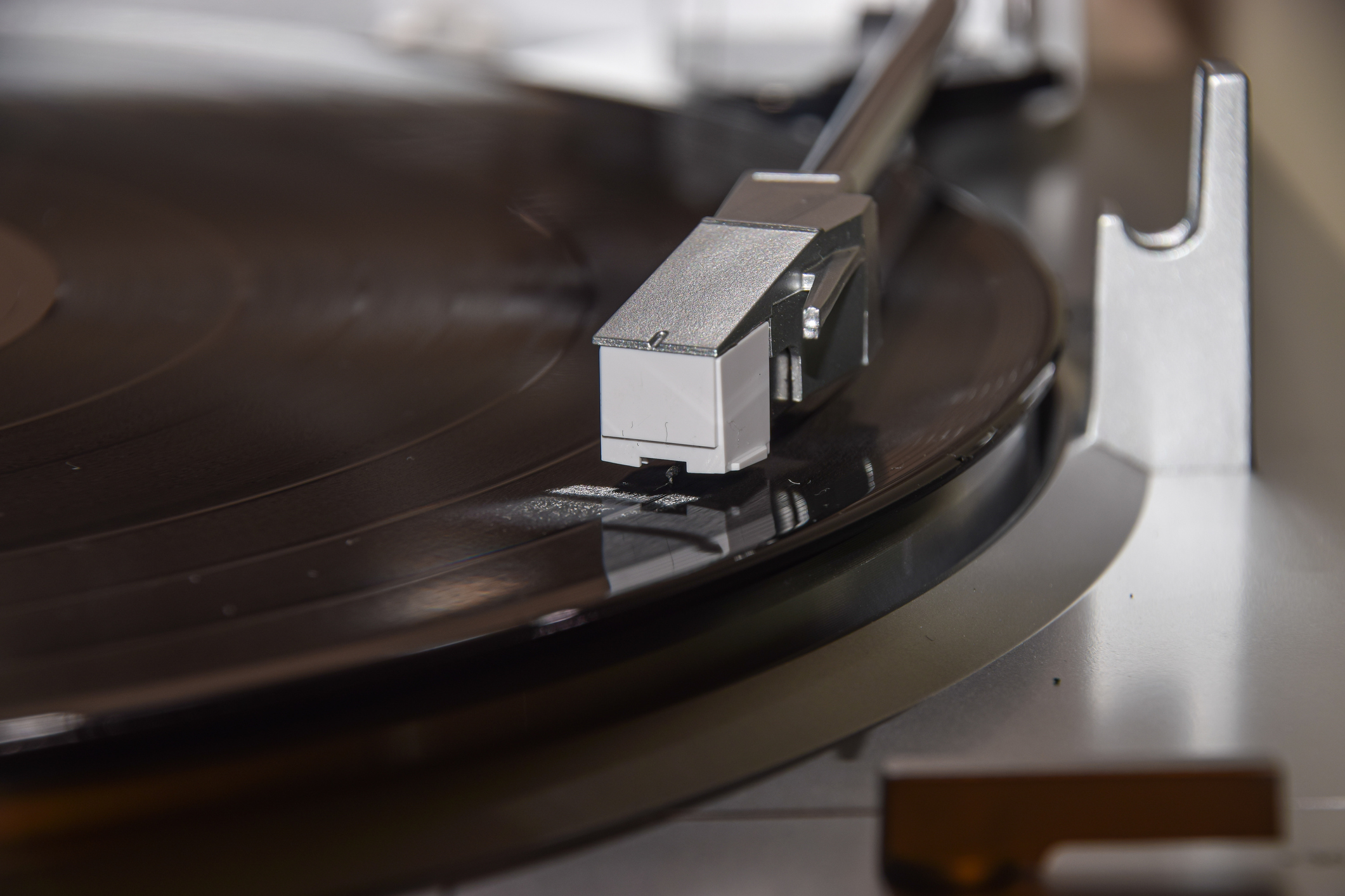 A vinyl LP record playing on a turntable