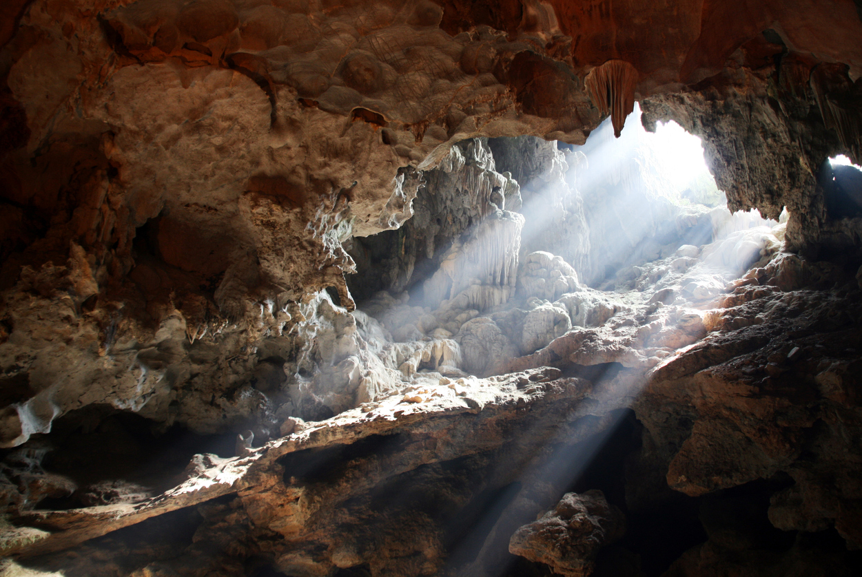 Light bursting through an opening in a cave in Vietnam
