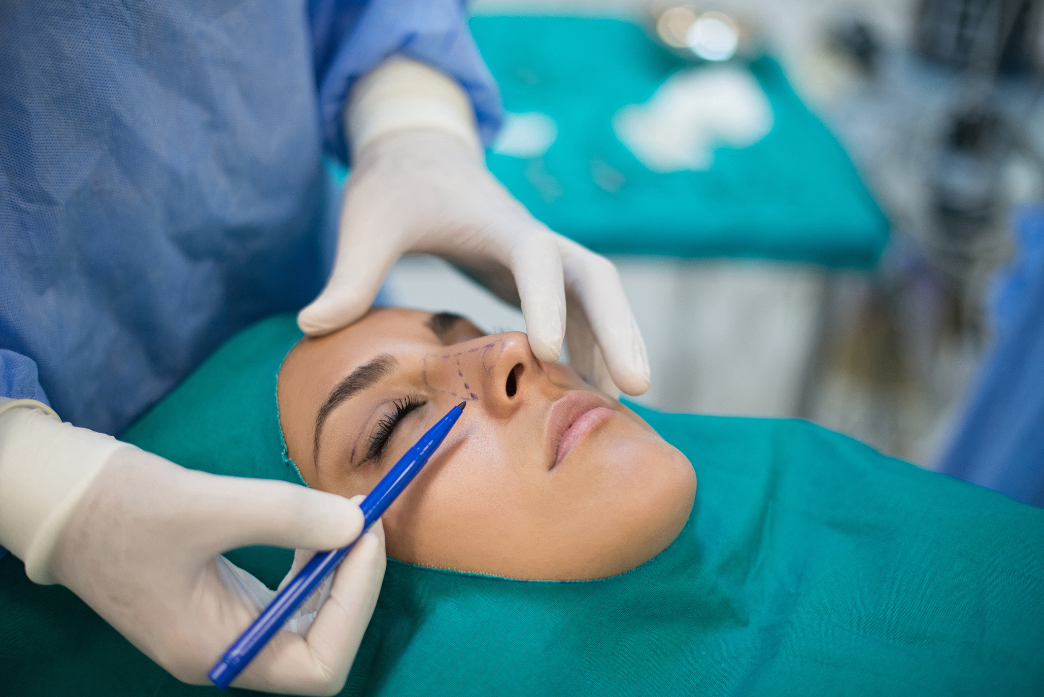 Young woman having facial plastic surgery
