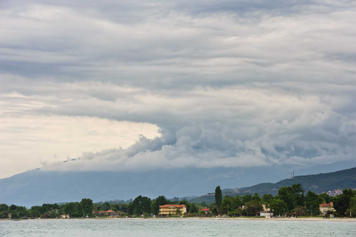 Rain over mountains and sea at the beach near Leptokaria town in the Greece