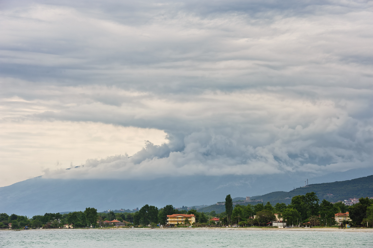 Rain over mountains and sea at the beach near Leptokaria town in the Greece