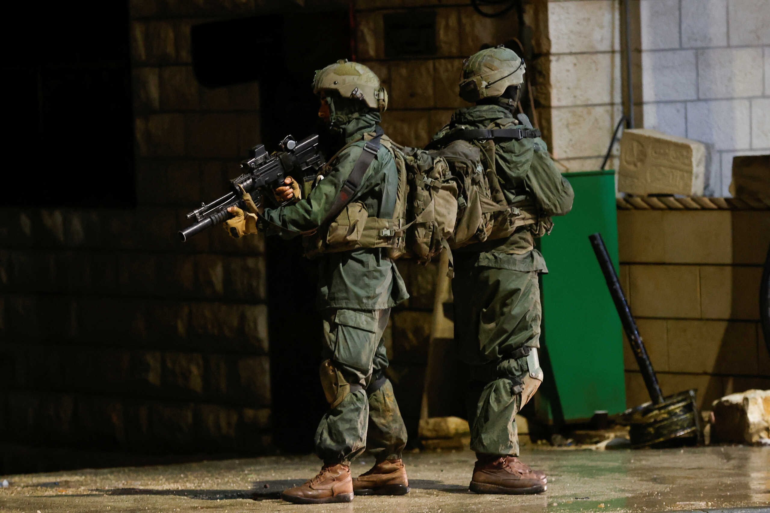 Israeli troops stand guard at the scene of a shooting, in Huwara, in the Israeli-occupied West Bank, March 19, 2023. REUTERS