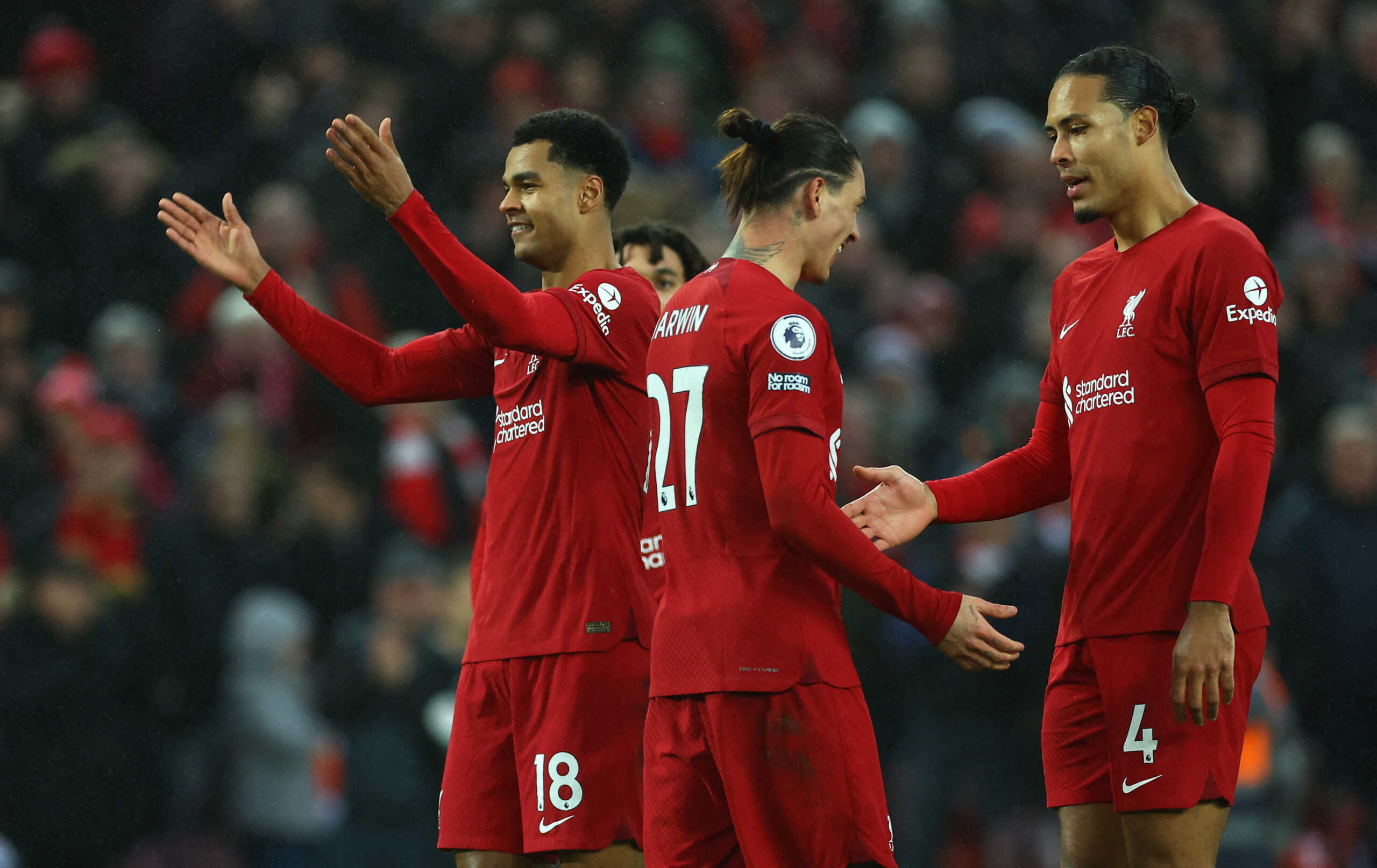 Soccer Football - Premier League - Liverpool v Manchester United - Anfield, Liverpool, Britain - March 5, 2023 Liverpool's Cody Gakpo celebrates scoring their third goal with Virgil van Dijk and Darwin Nunez REUTERS