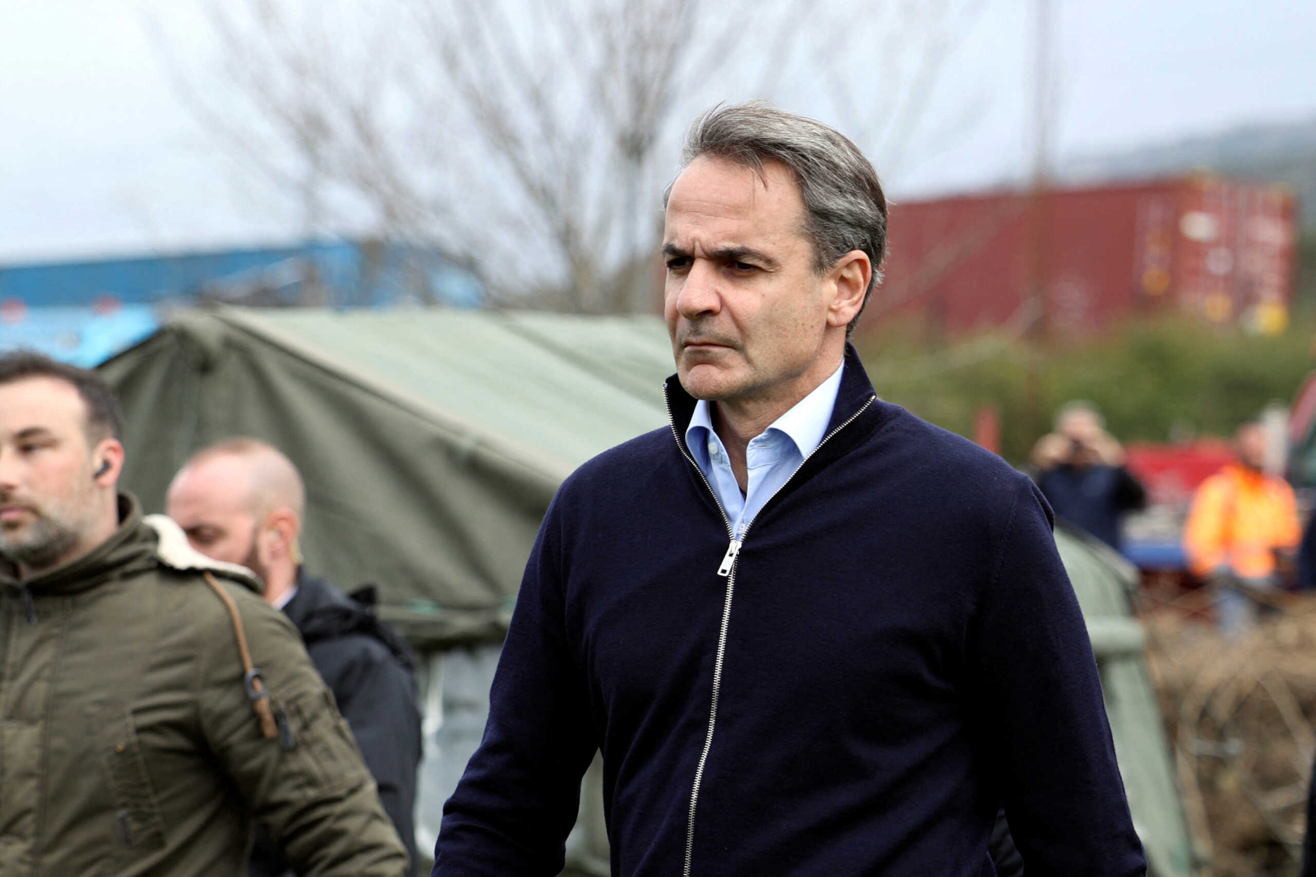 Greek Prime Minister Kyriakos Mitsotakis visits the site of a crash, where two trains collided, near the city of Larissa, Greece, March 1, 2023. REUTERS