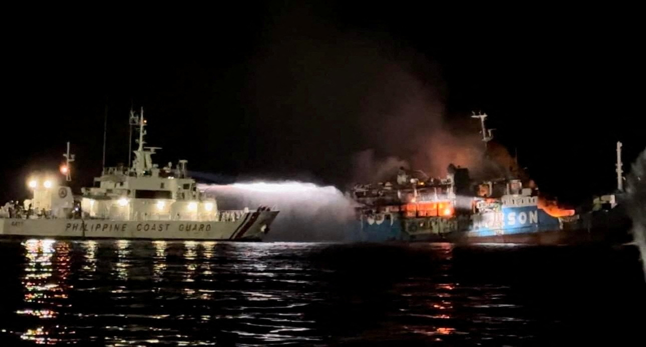 Philippine Coast Guard respond to the fire incident onboard M
