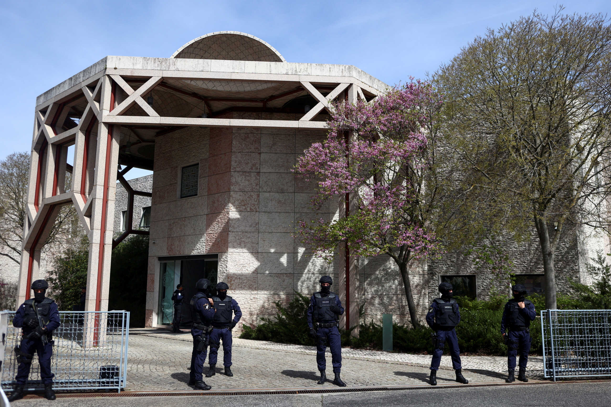 Police officers stand guard outside Ismaili Centre, after a deadly knife attack in Lisbon, Portugal, March 28, 2023. REUTERS