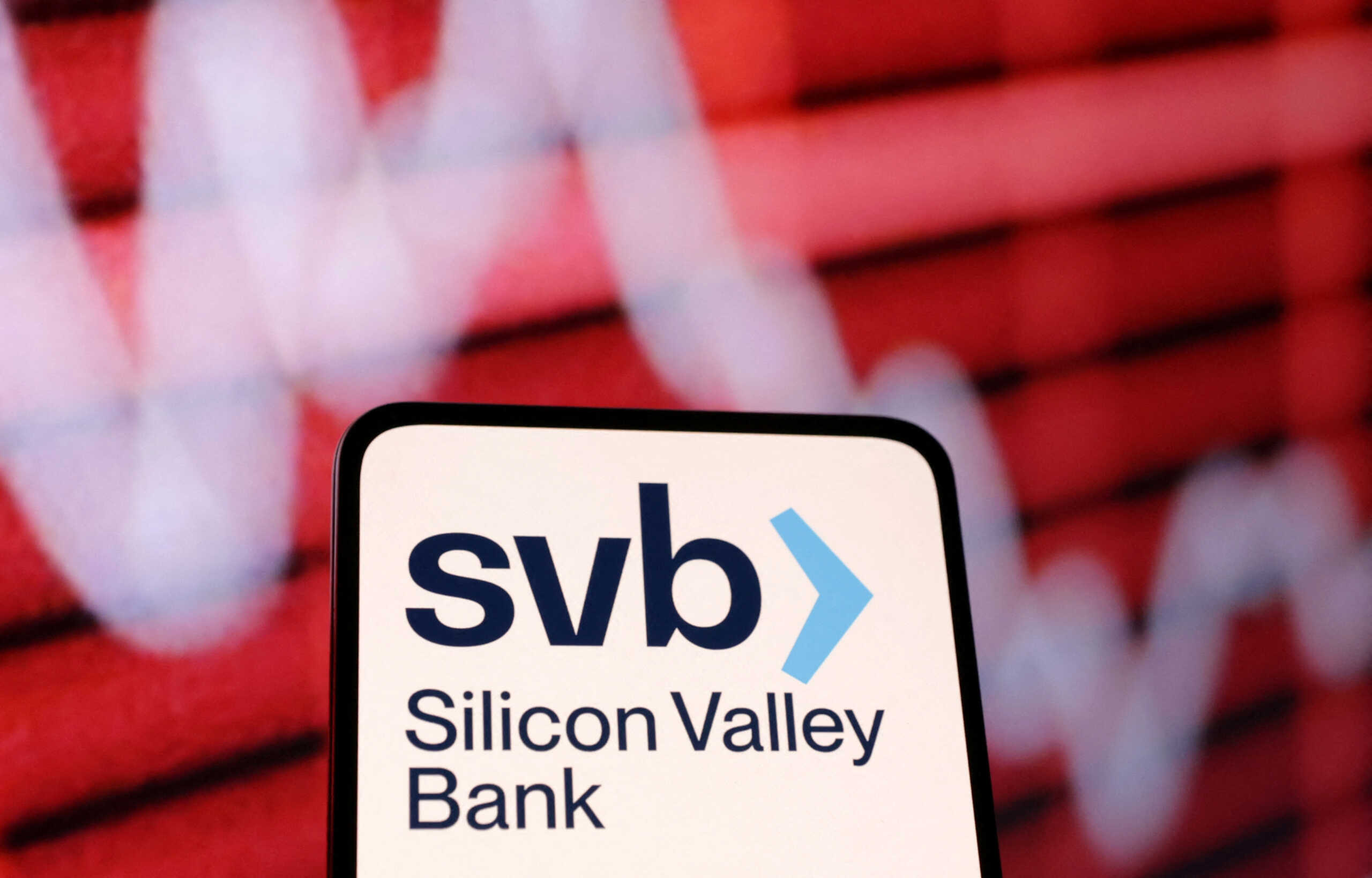 SVB (Silicon Valley Bank) logo and decreasing stock graph are seen in this illustration taken March 10, 2023. REUTERS