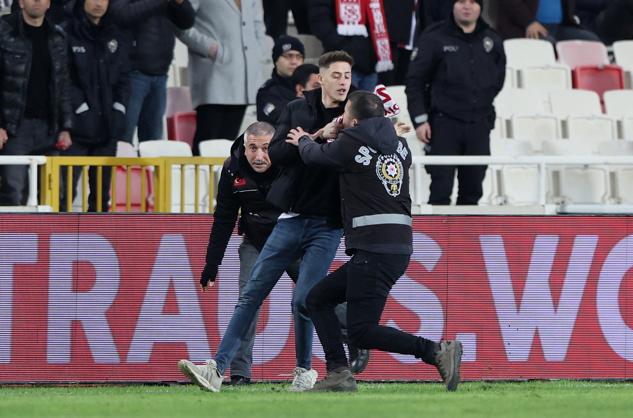 Soccer Football - Europa Conference League - Round of 16 - Second Leg - Sivasspor v Fiorentina - Yeni Sivas 4 Eylul Stadyumu, Sivas, Turkey - March 16, 2023 A pitch invader is detained by security after the match REUTERS